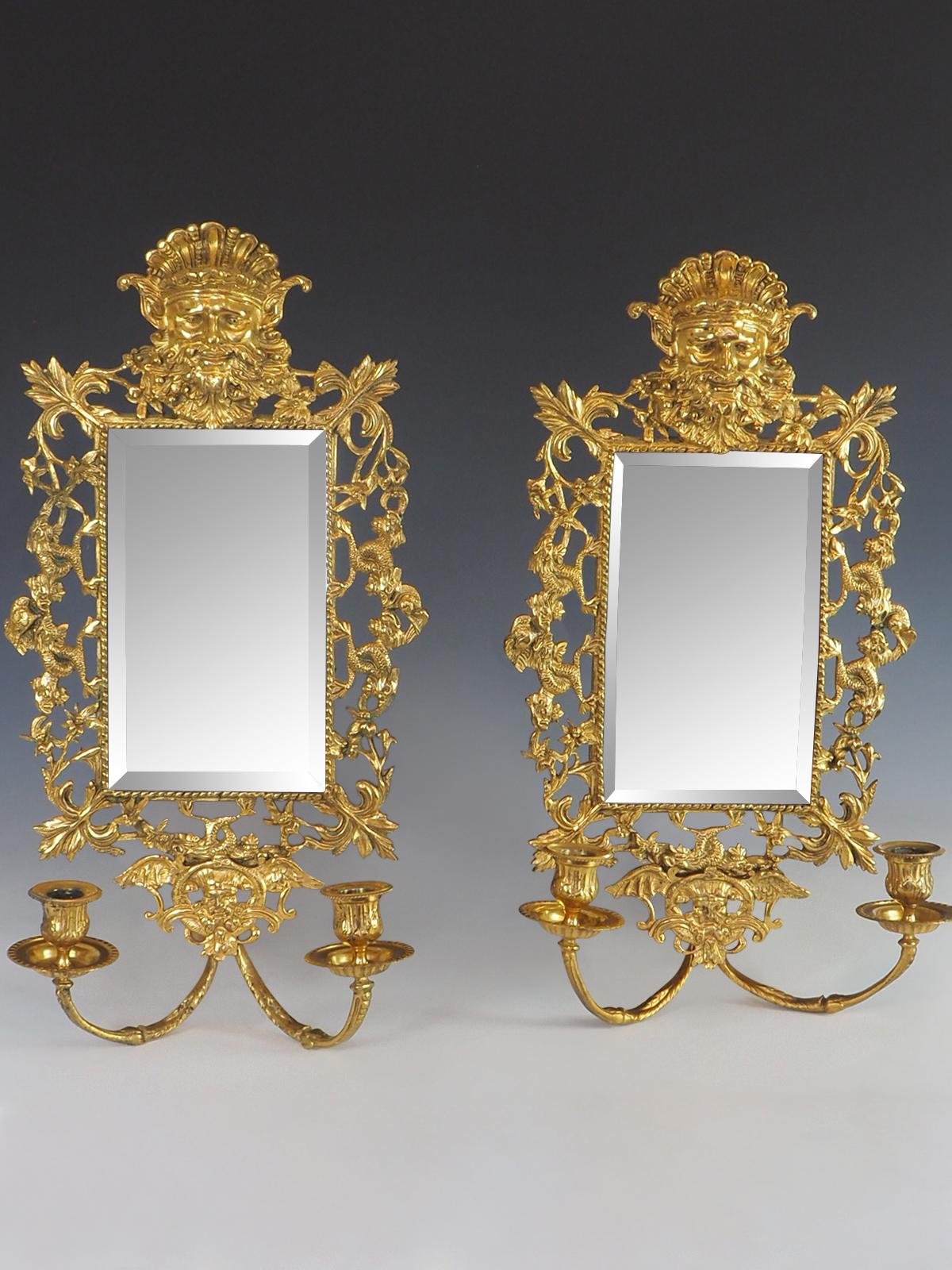 Pair of 19th Century 'Girandole' Italian Mirrored Wall Sconces

A stunning twin arm pair of wall scones headed by Neptune, the sea god, and surrounded by lots of mythical grotesque sea creatures.

The central mirror is beveled

Stamped JJ

This type
