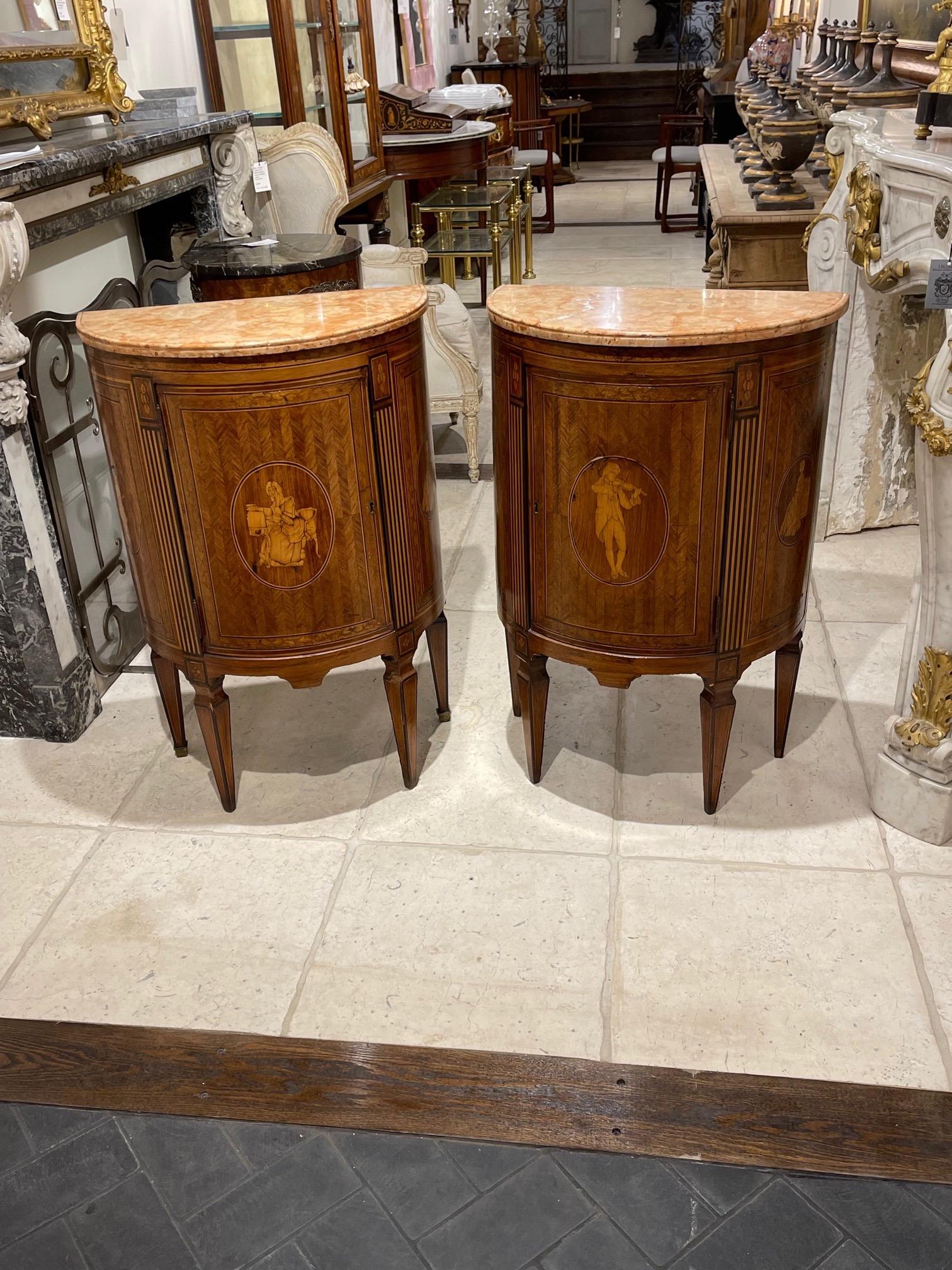 Exceptional pair of 19th century Northern Italian neo-classical style side tables. Featuring very fine inlaid images and a marble top. And when you open up the doors there are drawers inside. Very special!!.