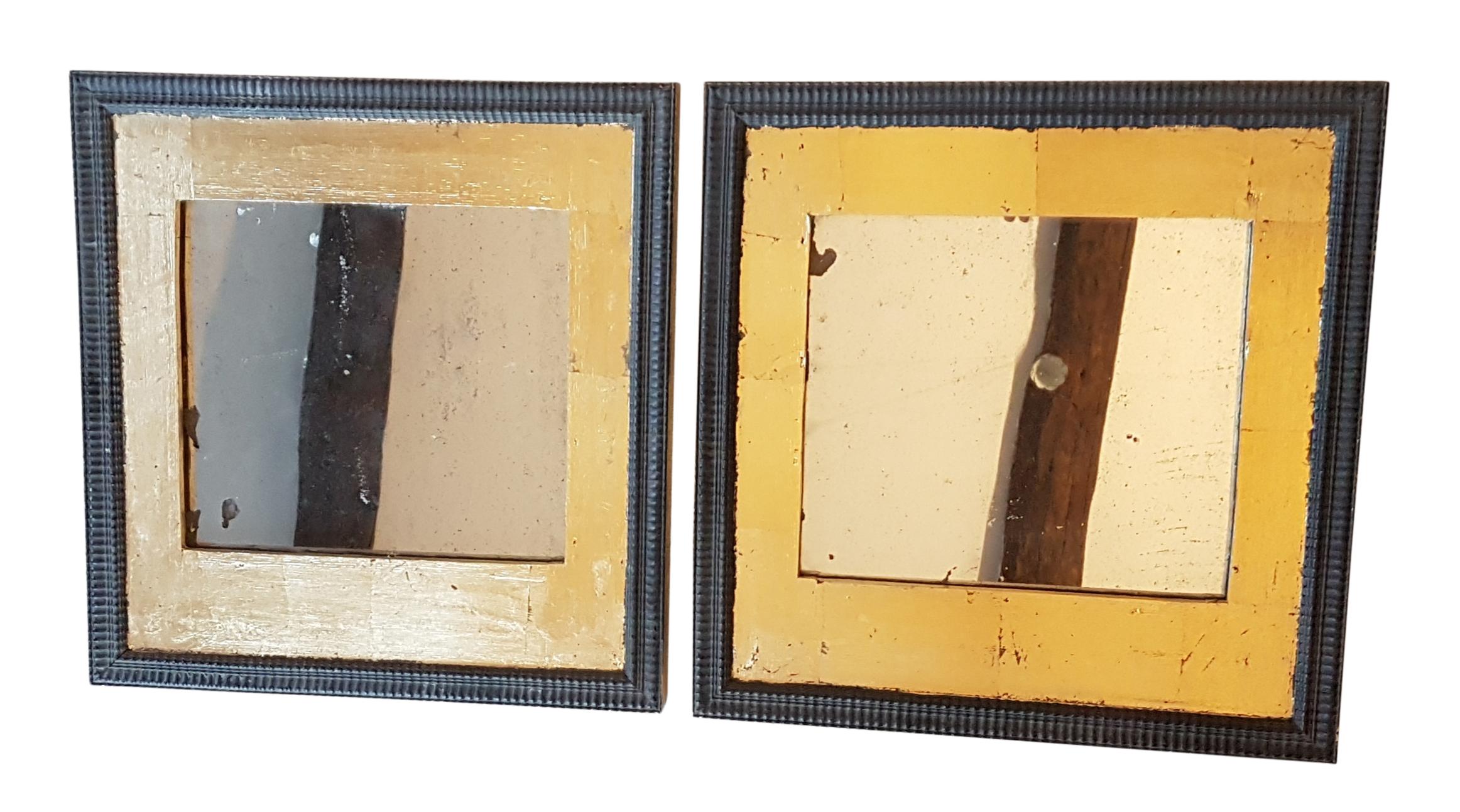 A very nice unique and decorative pair of mirrors. The frames are mid-19th century oak on pine with mahogany moldings with later gilt decoration over the oak. 19th century pitted and foxed mirror plates have been fitted into them.