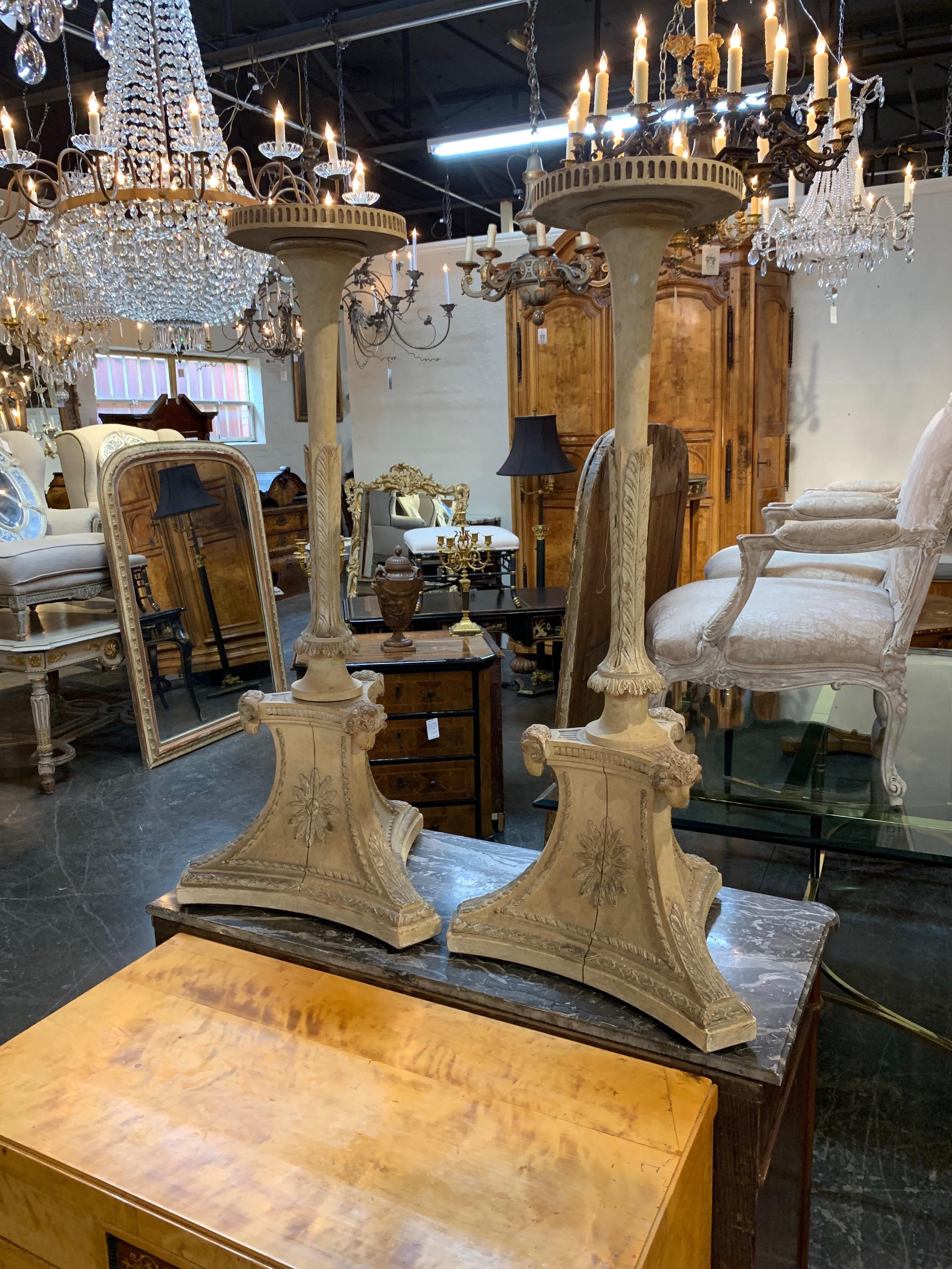 Pair of 19th century French carved and painted plant stands. Very nice carving and the neoclassical design would make a unique statement for your home or garden. The top of the pedestals is 10.5 inches. So pretty!