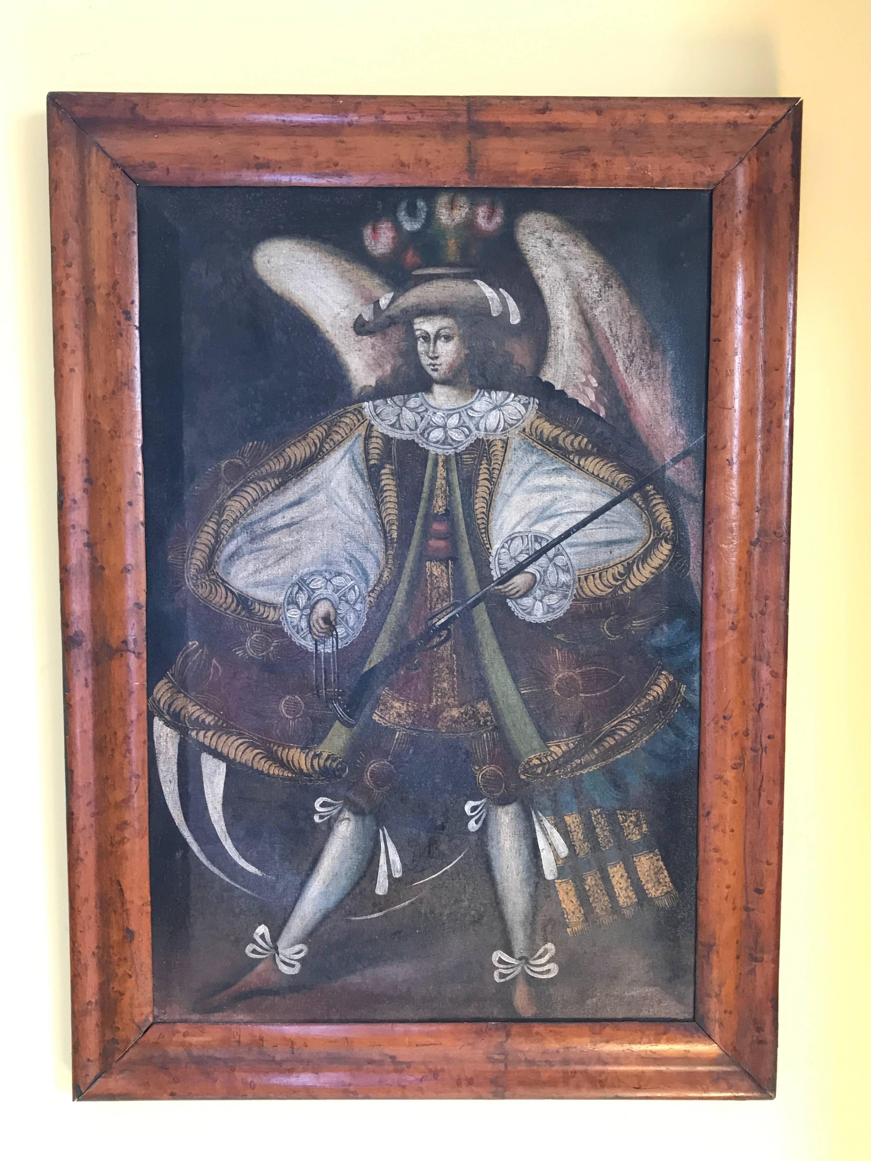 A pair of 19th century oils on canvas in the 16th century manor in the Cusco school depicting two winged arc angels holding muskets and traditional 16th attire in Maple frames.