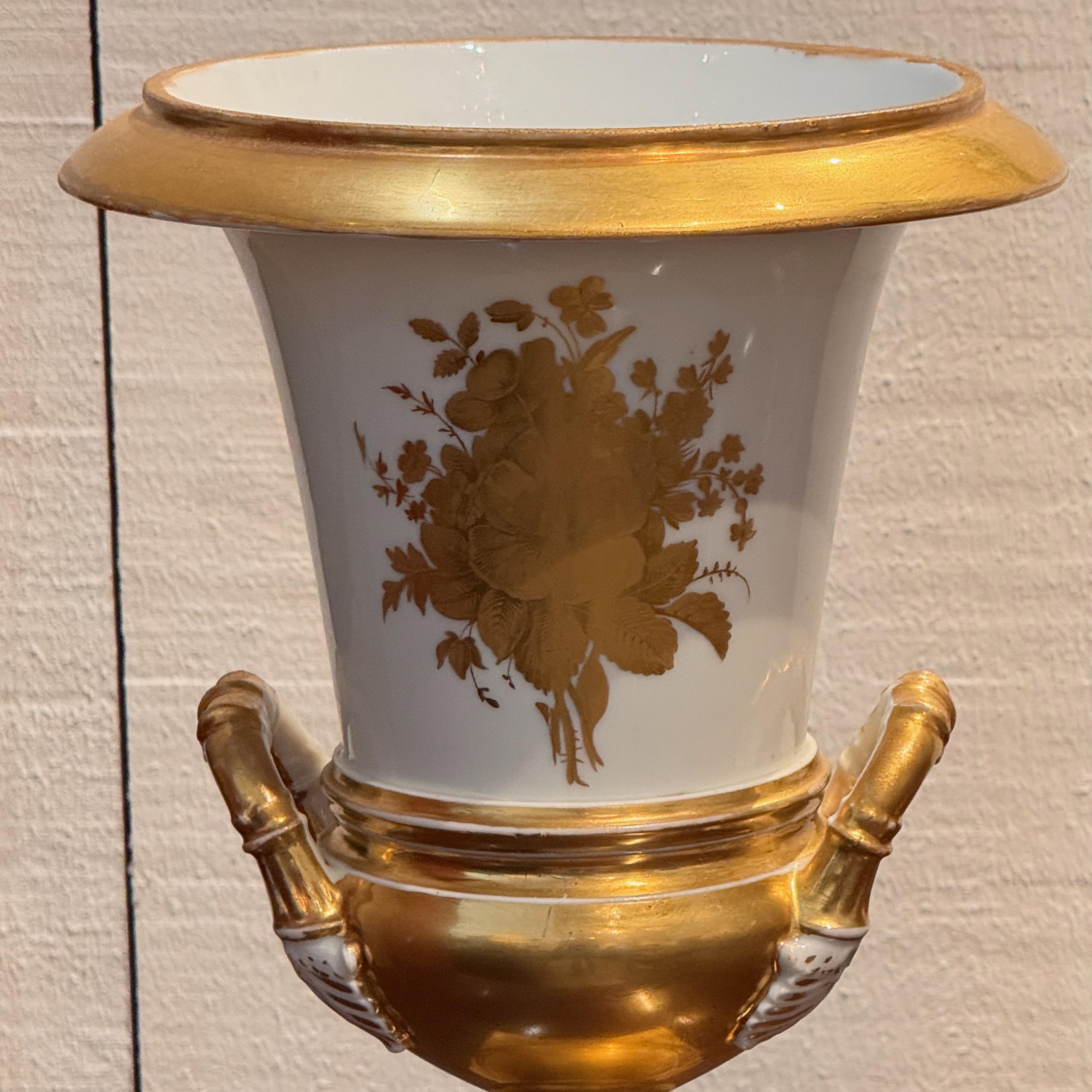 Pair of 19th century Old Paris porcelain urns with gilt handles and footed squar In Good Condition For Sale In Charlottesville, VA