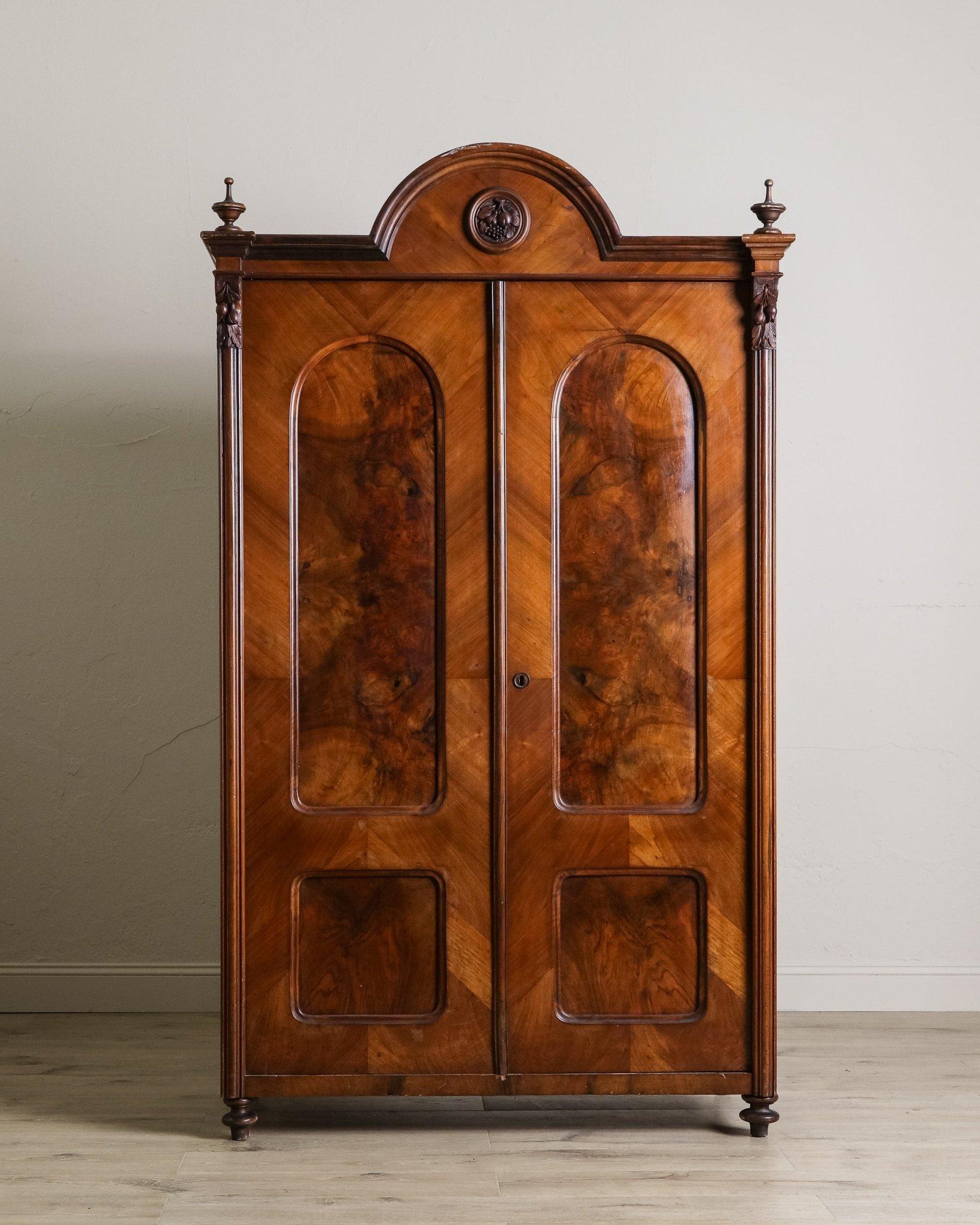 This rare matching set of 19th-century olive burlwood armoires showcases exceptional craftsmanship and timeless elegance. Meticulously constructed from rich olive burlwood and mahogany, each piece highlights the natural beauty and complexity of the