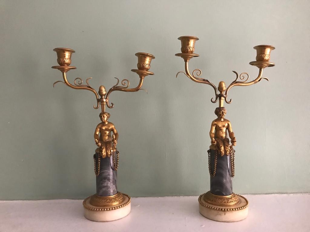 Beautiful pair of 19th century ormolu and marble candelabra with lovely figurines of mermaid/merman with human torso and fishtail in ormolu and double candelabra mounted on a marble base. 

Approximate dimensions: 14 inches high x 8.5 inches