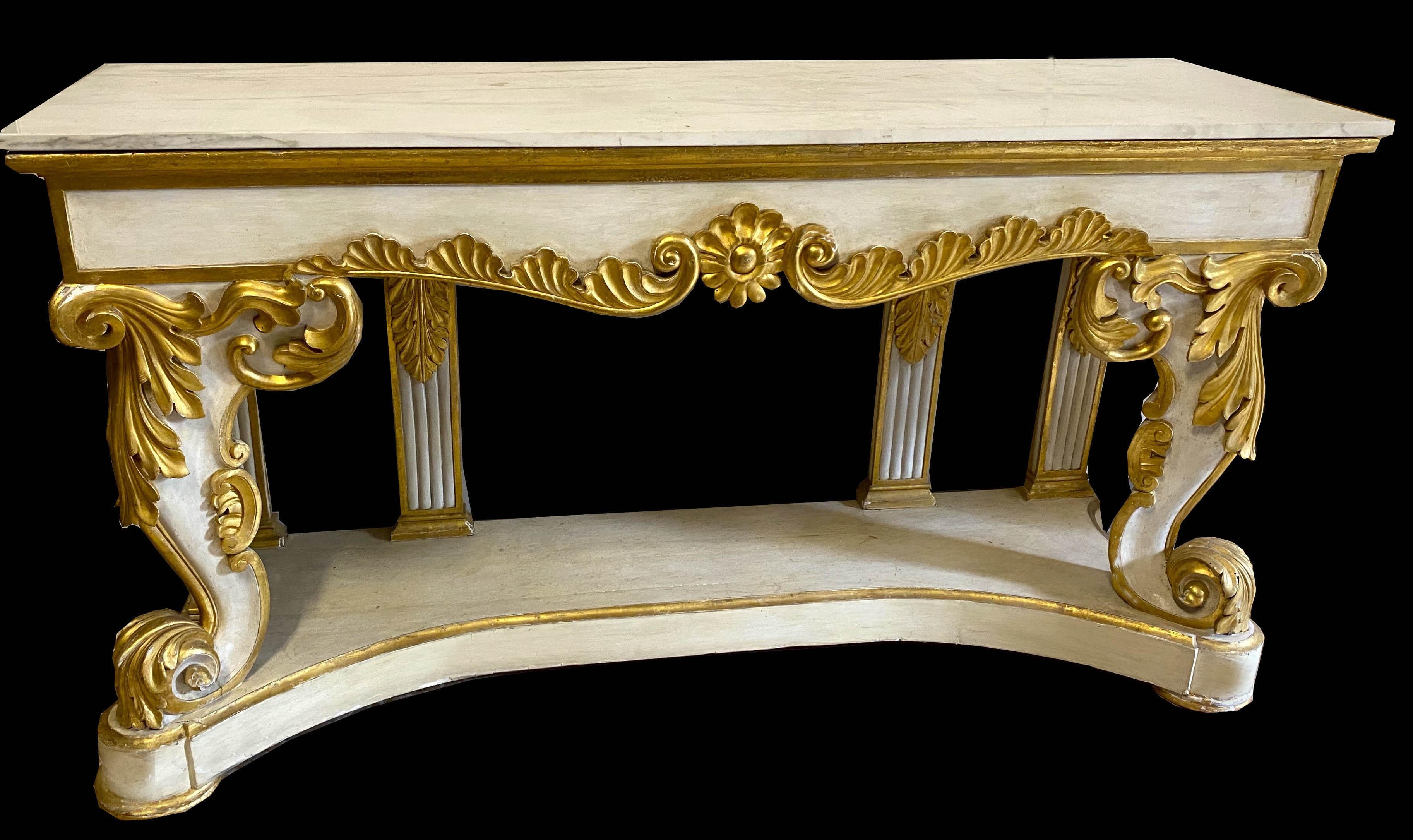 Elegant Italian 19th century ivory painted and parcel-gilt console tables with a white Carrara marble top.

 