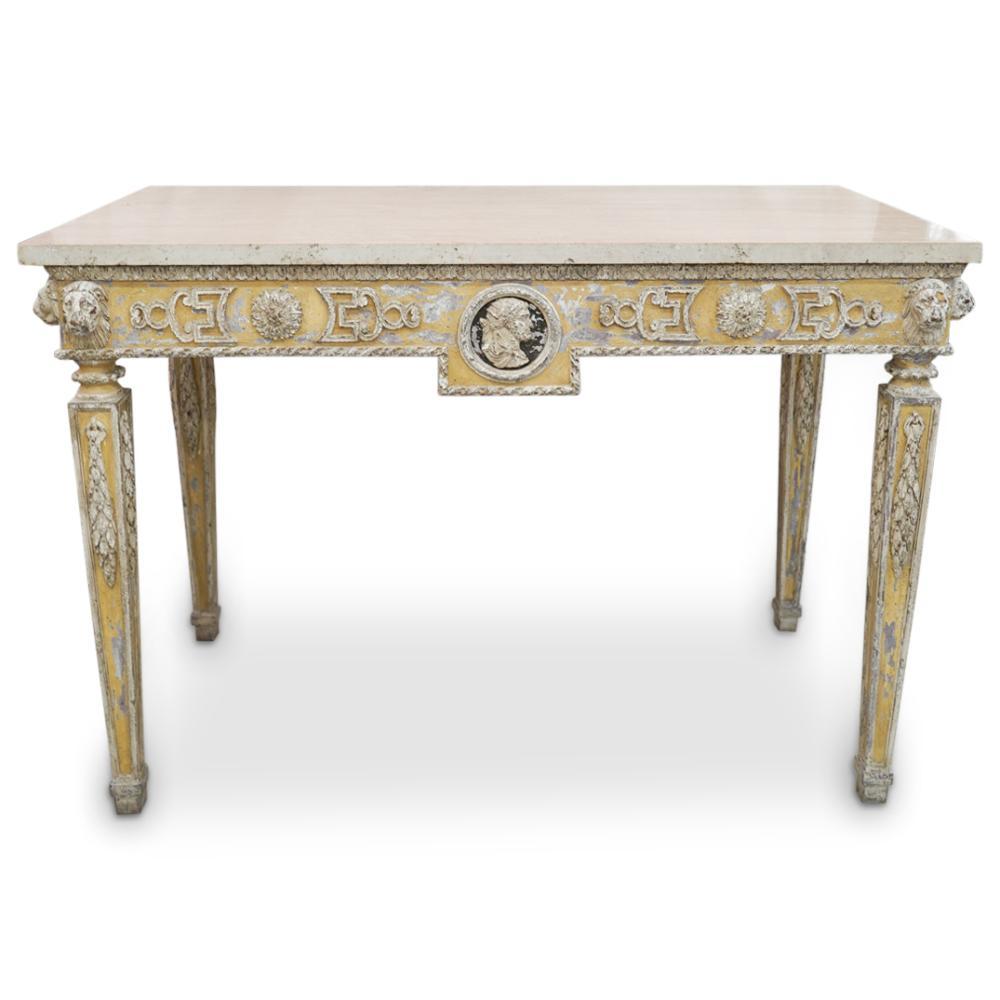 Pair of Italian or French neoclassical console tables. Wonderful neoclassical form with lion heads and Roman Profile Plaques. Marble tops. Beautiful distressed surface.
 
  