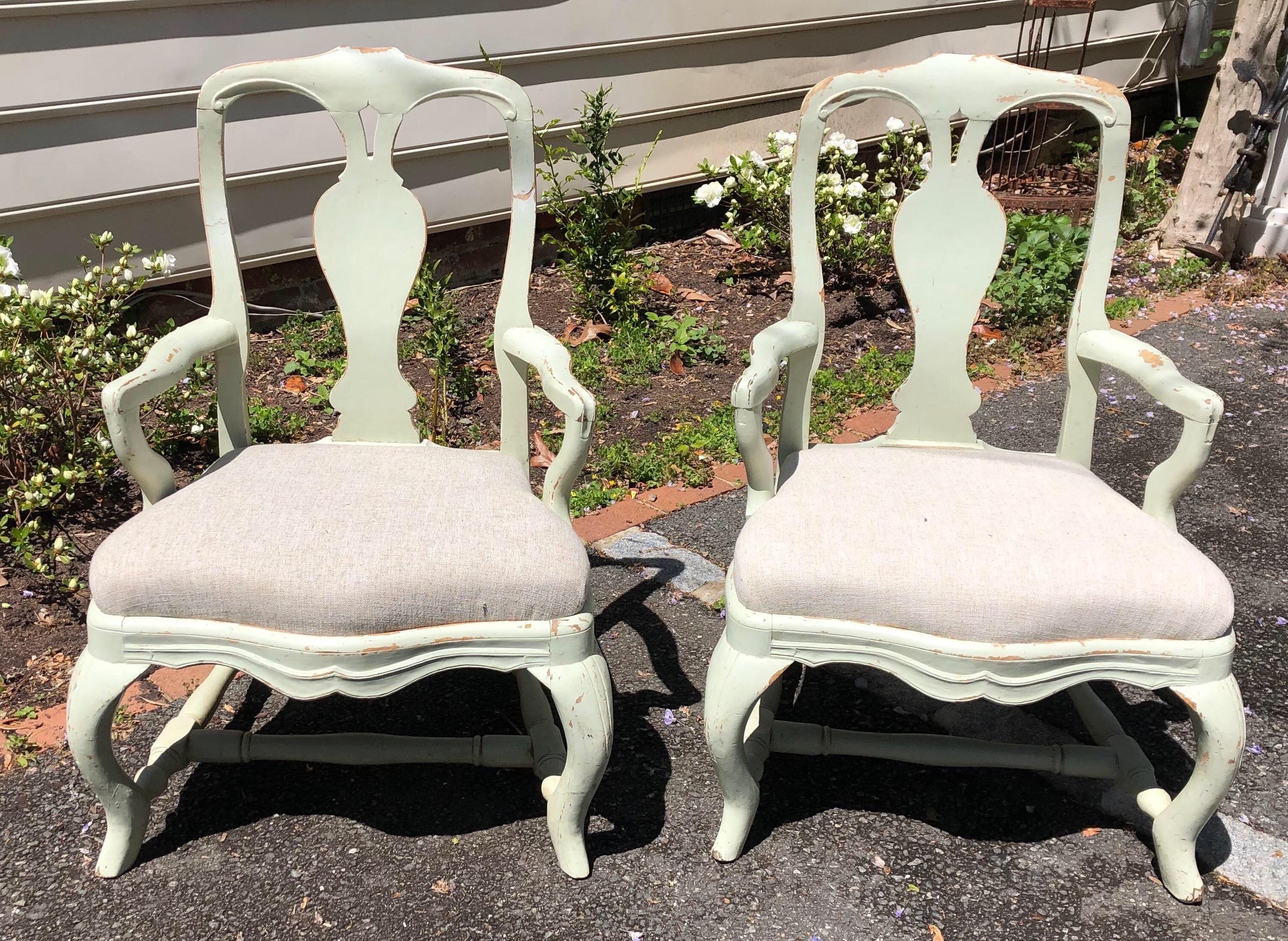 Pair of 19th century painted Swedish armchairs with serpentine shaped seats. Nice patina with expected light chipping in paint. Seats newly reupholstered.