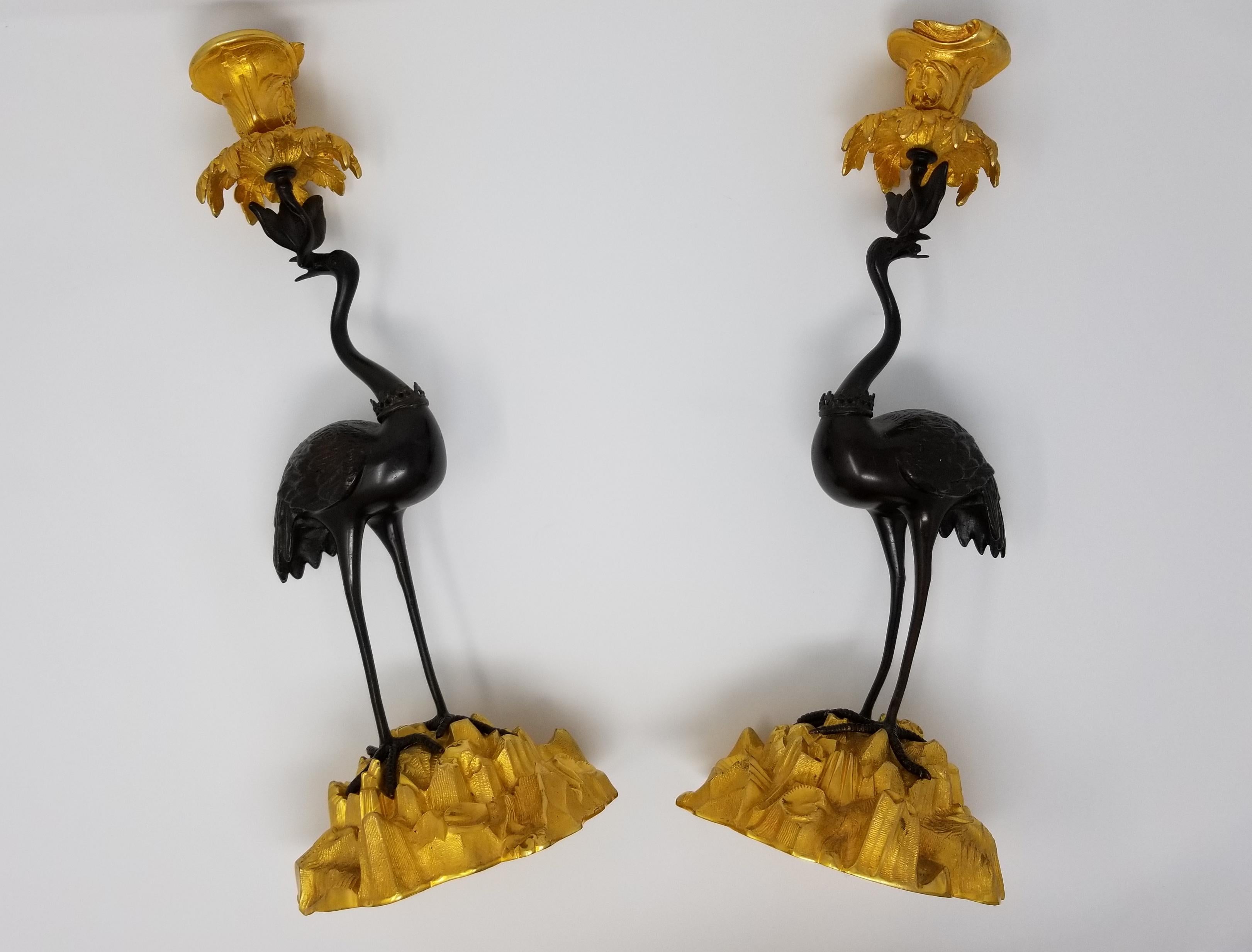 Late 19th Century Pair of 19th Century Patinated and Gilt Bronze Standing Crane-Form Candlesticks