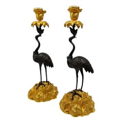 Pair of 19th Century Patinated and Gilt Bronze Standing Crane-Form Candlesticks