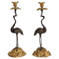 Antique Pair of 19th Century Patinated and Gilt Bronze Standing Crane-Form Candlesticks