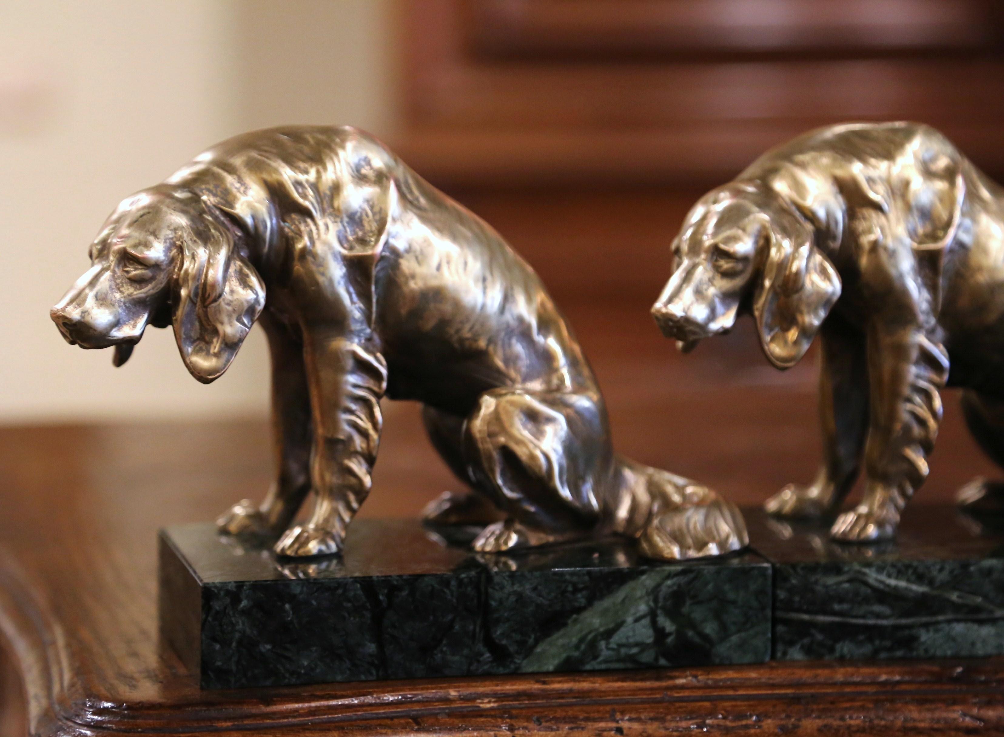 Organize your library book shelves with this pair of antique dog sculpture bookends. Crafted in France circa 1880, and built of bronze, these doggy sculptures rest on a rectangular variegated green marble base; each canine features a detailed and