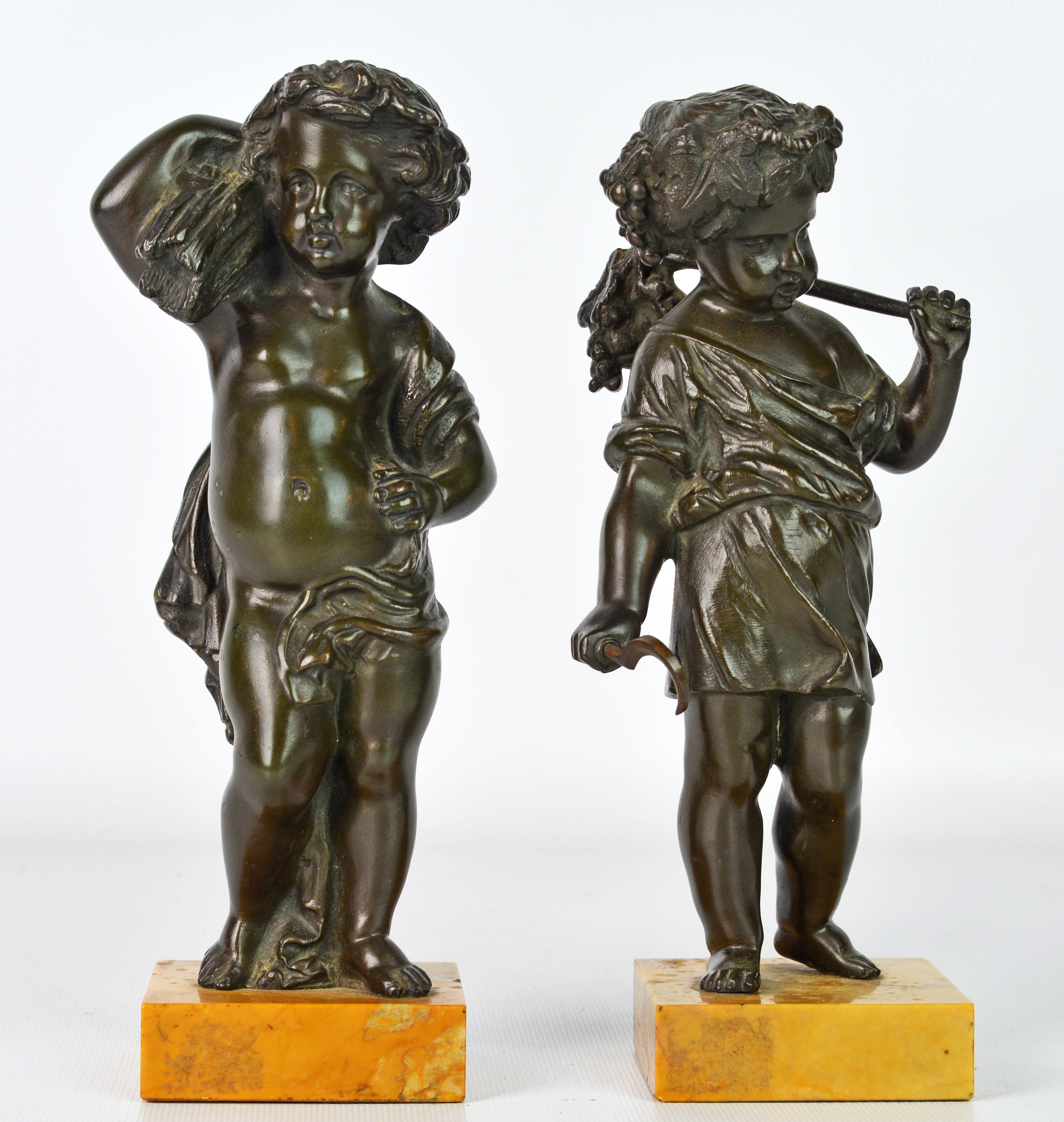 A good pair of 19th century bronze putti modeled as harvesters, the boy looking to his right, a cloth draped to his waist and one shoulder, holding a wheat-sheaf on his right shoulder and with a garland in his hair, the girl looking to her left with