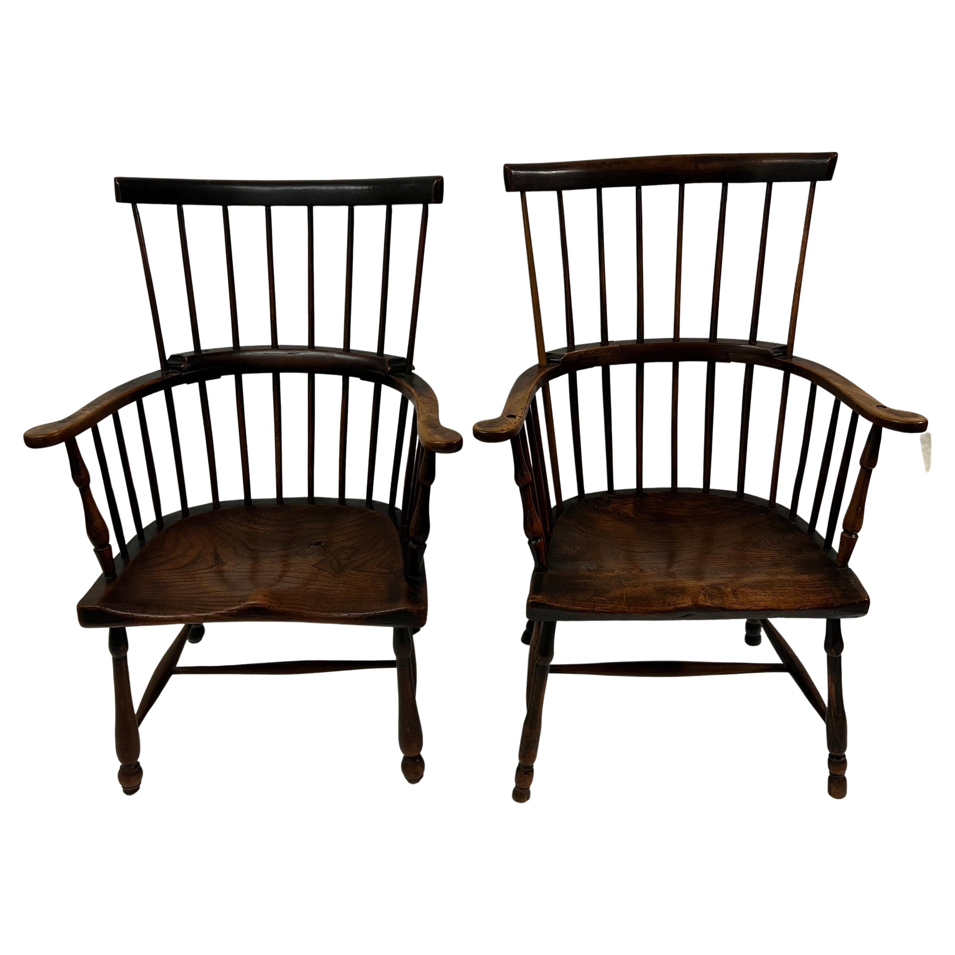 A Pair of Wonderfully patinated Windsor Chairs.  The pair are the most beautiful Windsors we have ever seen.  Perfectly suited for any room, or to be captains chairs at the right table!  The patination is exquisite and the age of the chairs, while