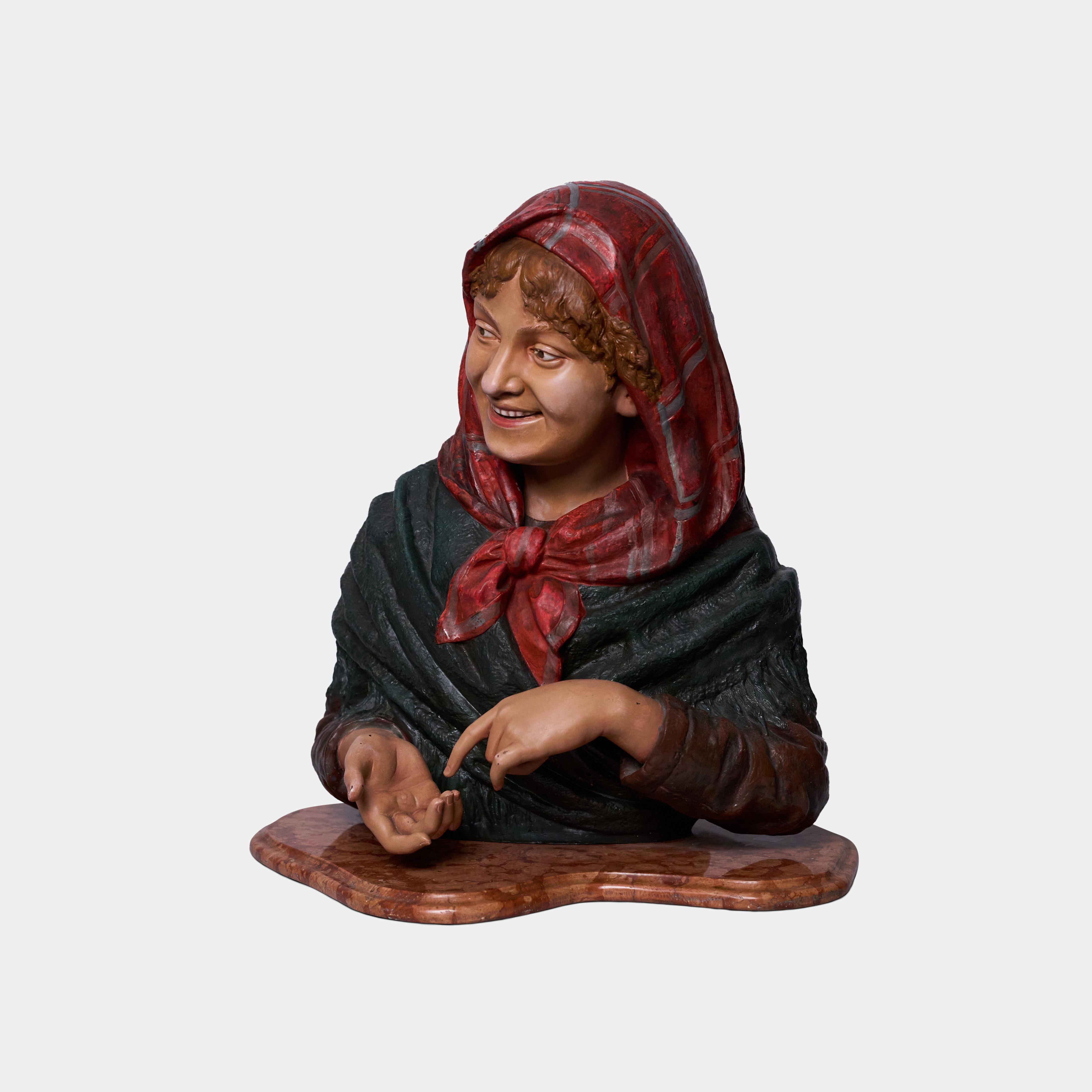 This charming 19th century pair of Polichrome metal figures by Louis Hottot depict a young woman and a young man. Rendered in lifelike detail, these busts seem to show the pair in conversation about a topic which has confused the boy and has