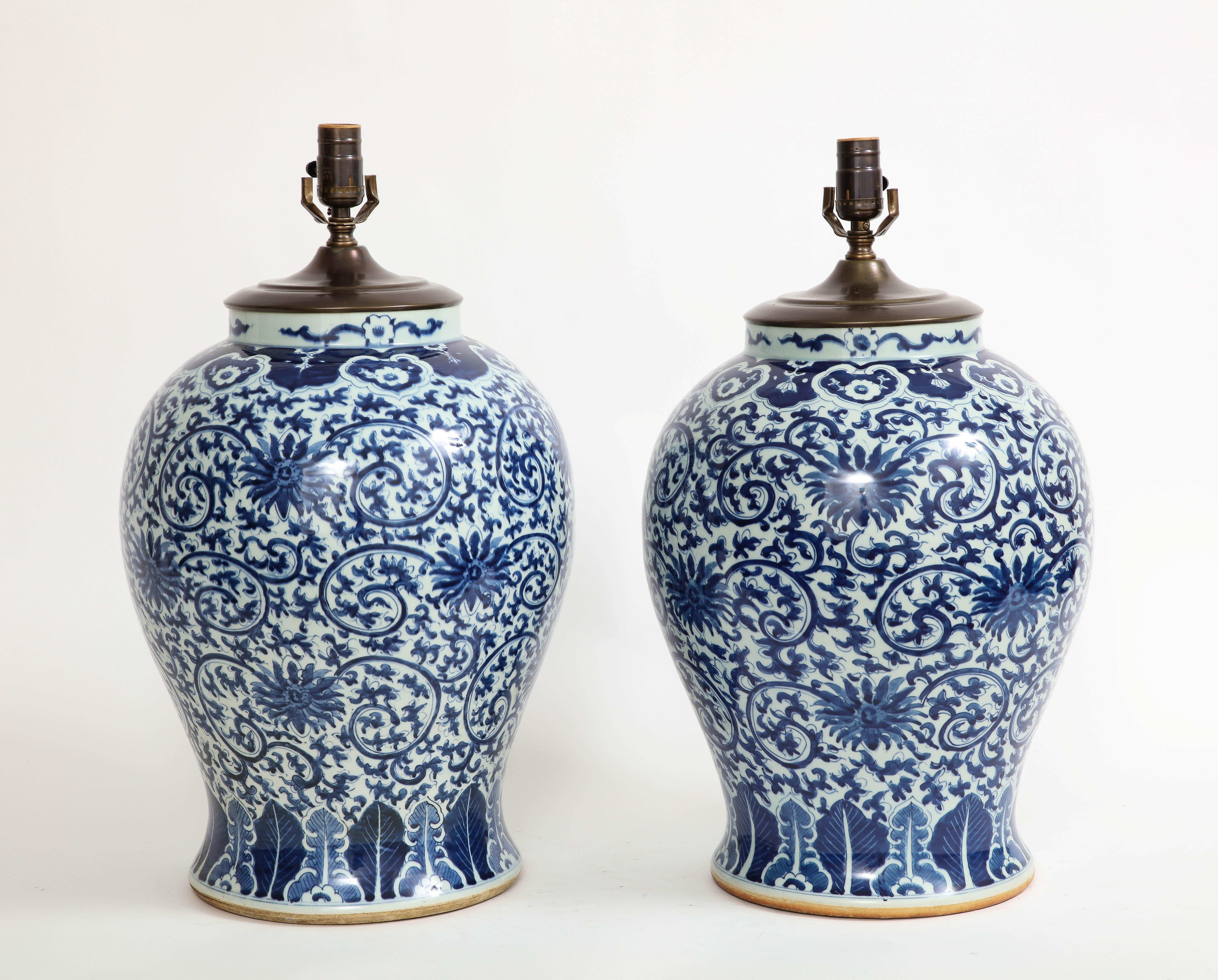 Porcelain Pair of 19th Century Qing Dynasty Chinese Blue and White Vases Turned to Lamps For Sale