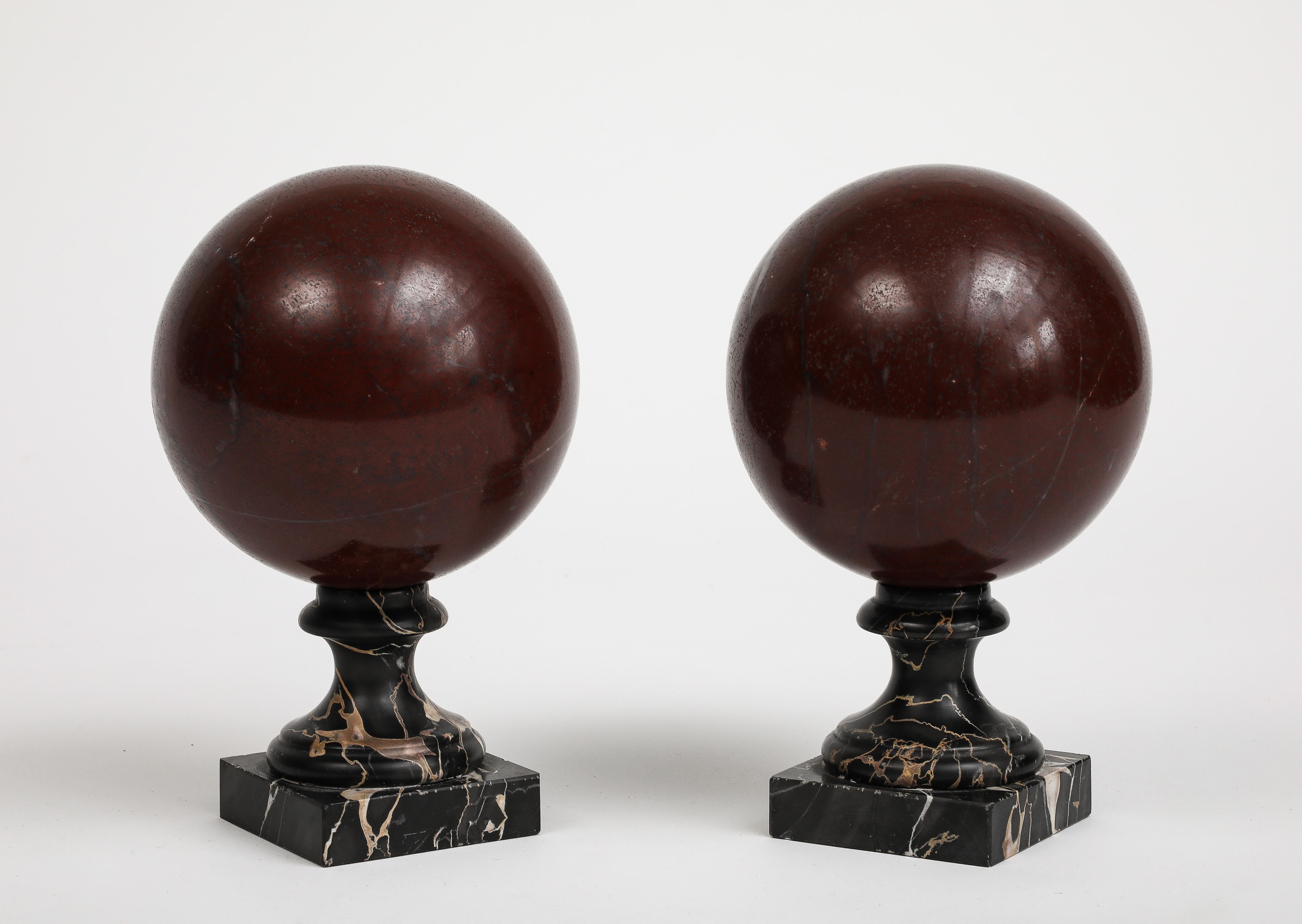 Italian Pair of 19th Century Red Marble Spheres on Black Marble Stands For Sale