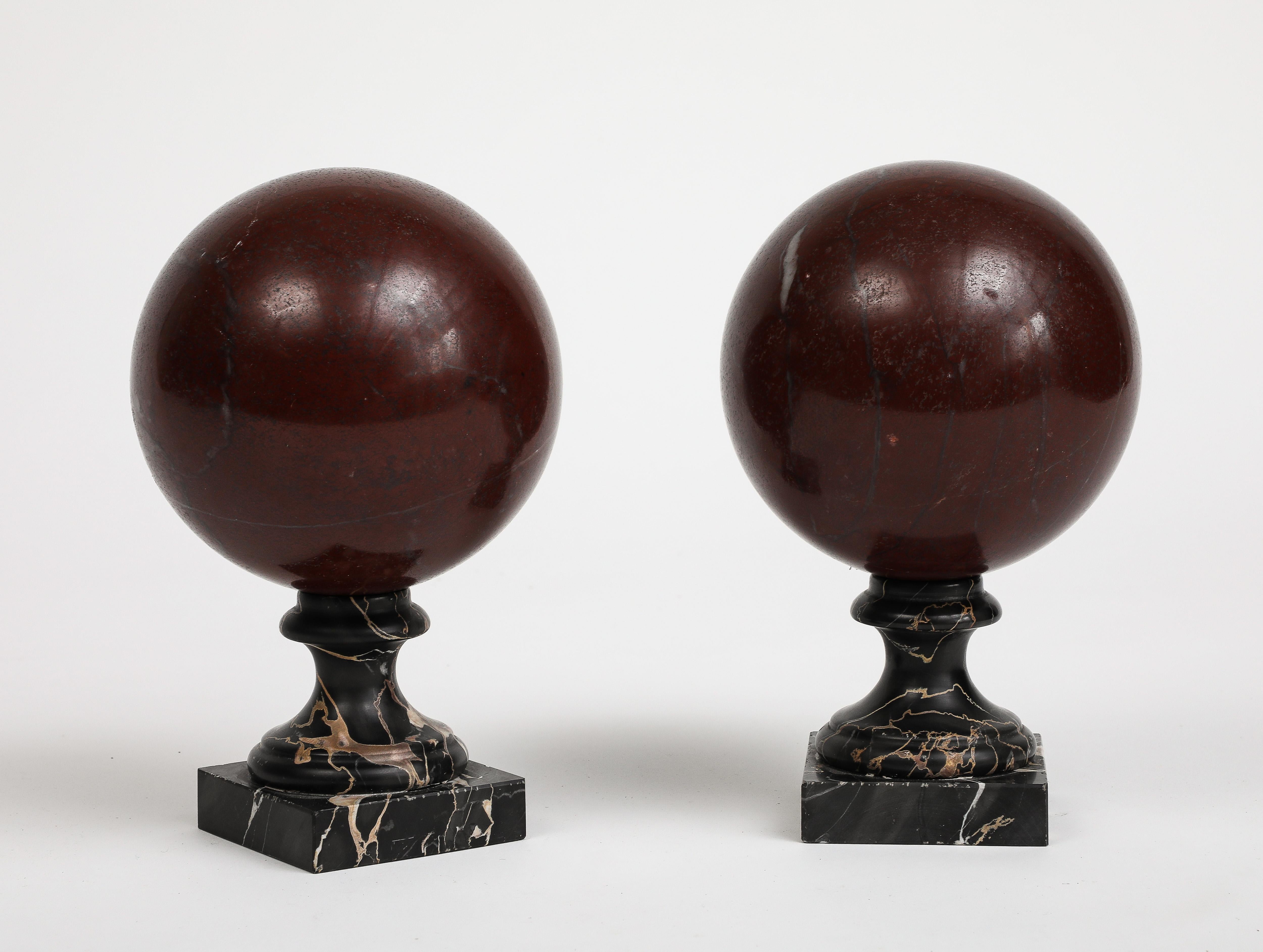Pair of 19th Century Red Marble Spheres on Black Marble Stands In Good Condition For Sale In Chicago, IL