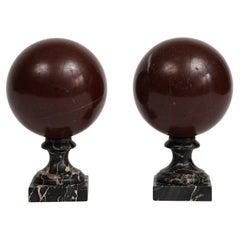 Antique Pair of 19th Century Red Marble Spheres on Black Marble Stands