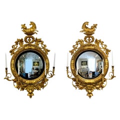Paire de girandoles à miroir convexe de style Régence du XIXe siècle avec hippocampe