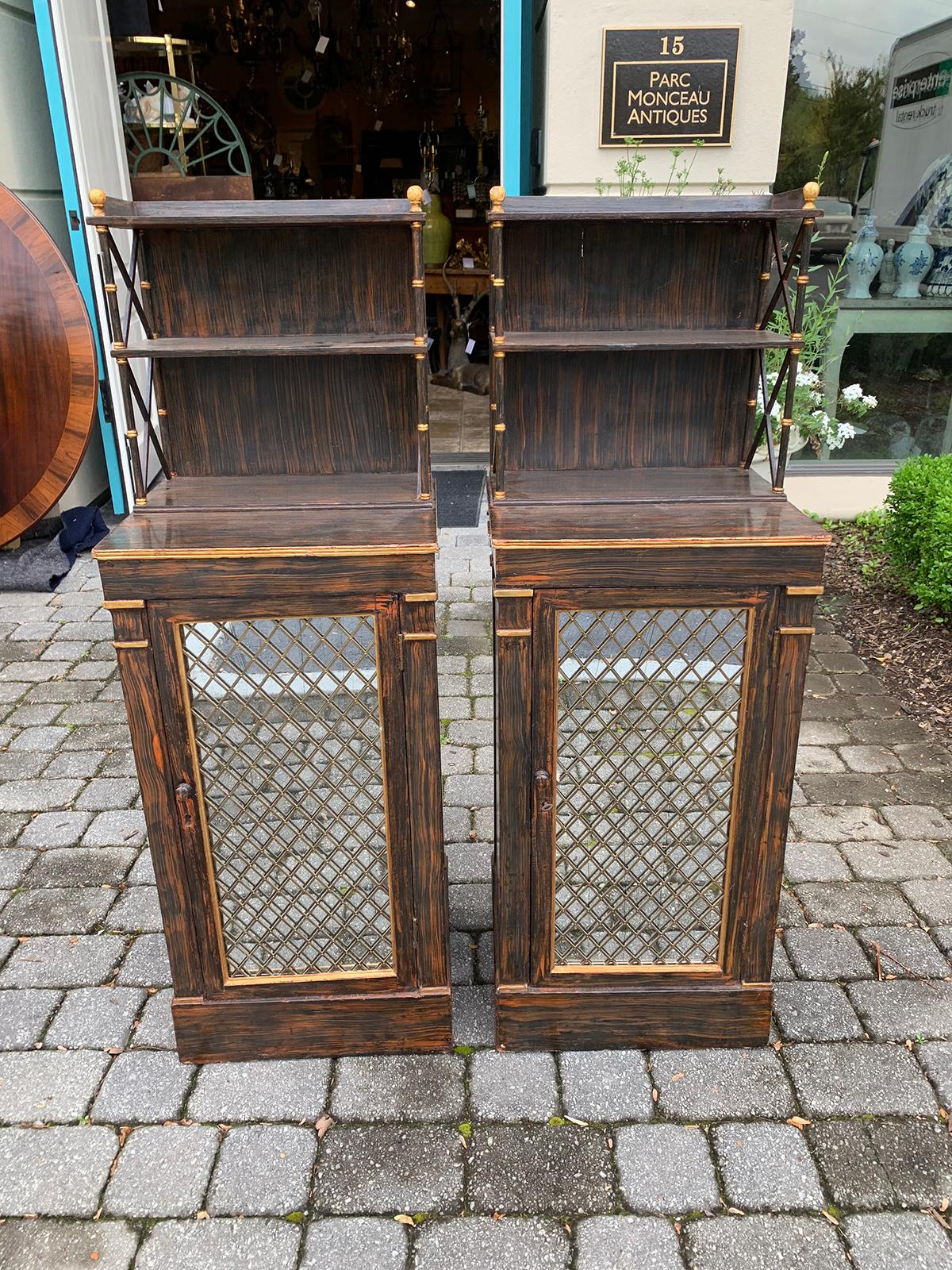 Pair of 19th century Regency faux Bois Chiffoniers, mirrored door, circa 1825
Three shelves inside
Two exposed shelves on top
Keys for door.