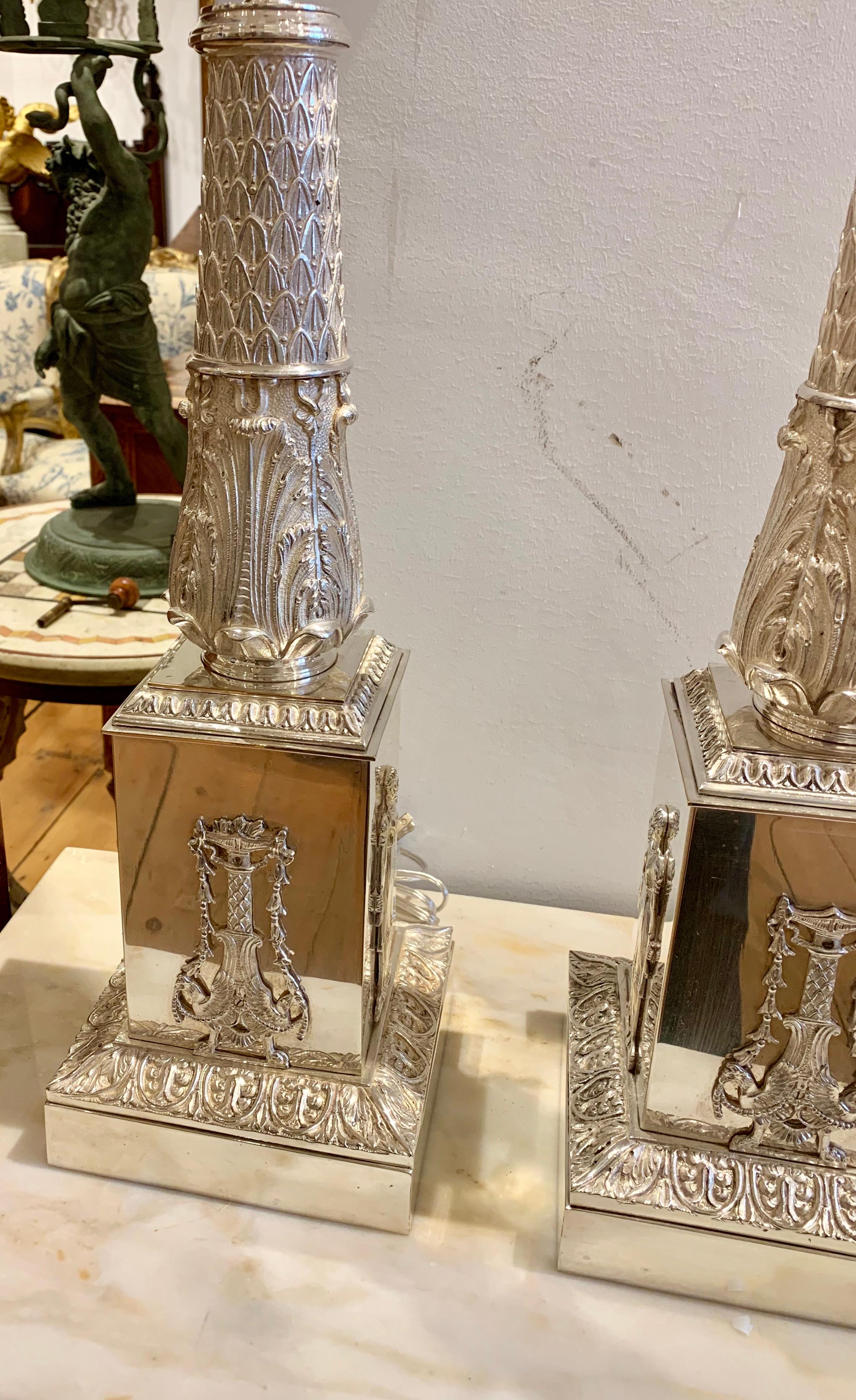 Pair of exquisite 19th century silvered candelabra turned into lamps.

Neoclassical or Empire form, with hand stippled and chaisted work. Original silver on bronze. Now as lamps. Newly wired and fitted with nickel plated hard and electrical.