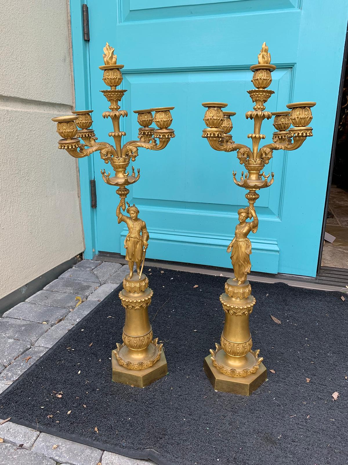 Pair of 19th century Regency style gilt bronze four arm figural candelabras / candleholders.