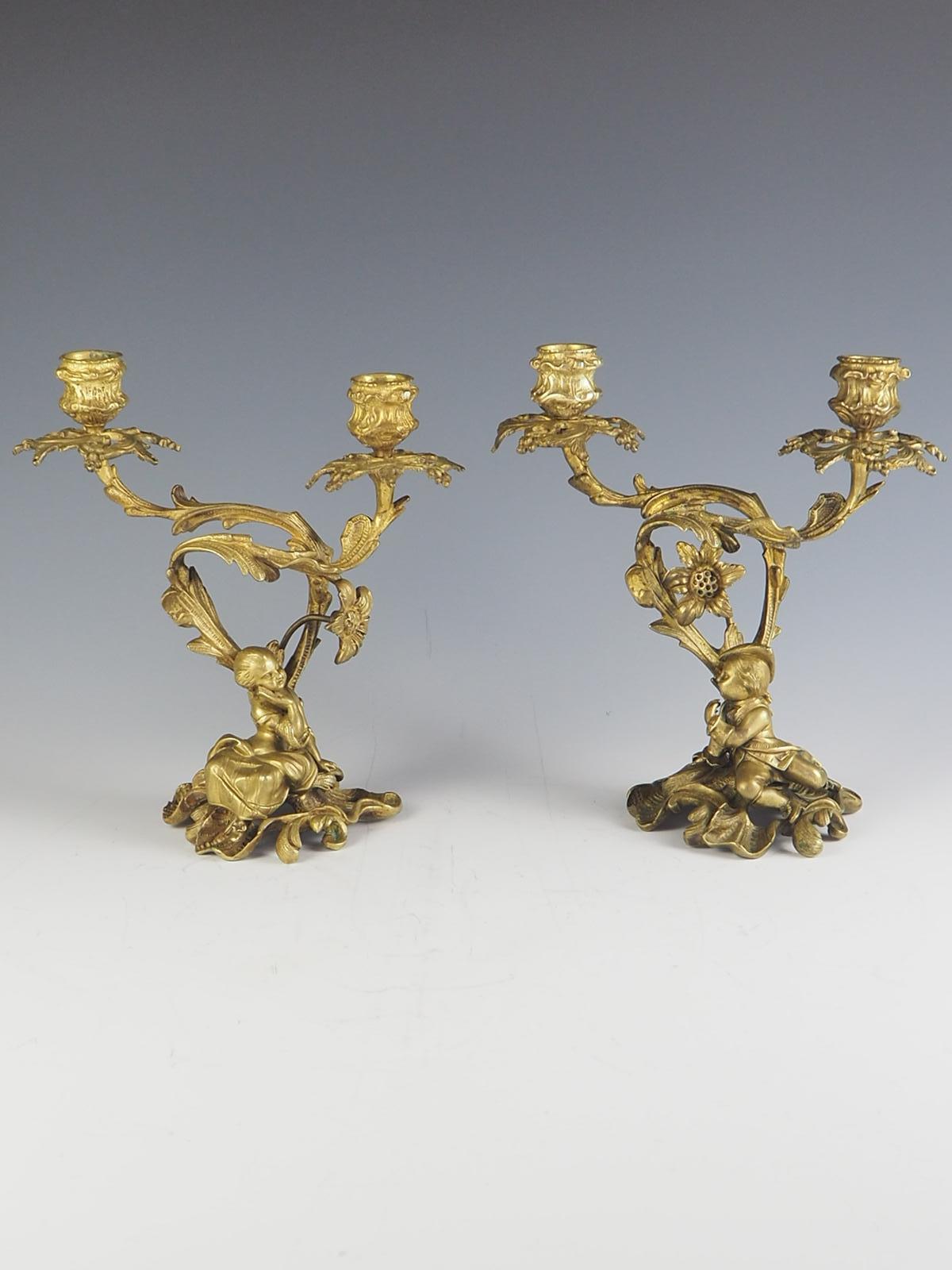 Pair of 19th Century Rococo Revival Ormolu twin candelabra

Young courting couple, reclining to left and right beneath flowering branches

c.1860.