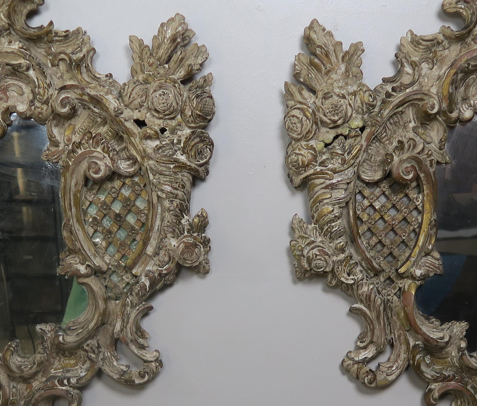 Pair of 19th Century Rococo Style Italian Carved Mirrors with Cherubs In Distressed Condition In Los Angeles, CA