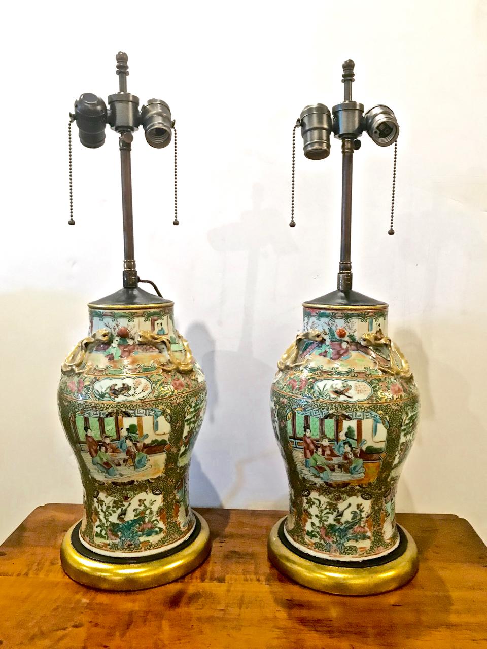 This is a good pair of mid-19th century Rose Canton vases that have been fitted as lamps. The vases are finely painted, are in excellent condition and have not been drilled for the electrical fittings. We have elected to use the French wire format.