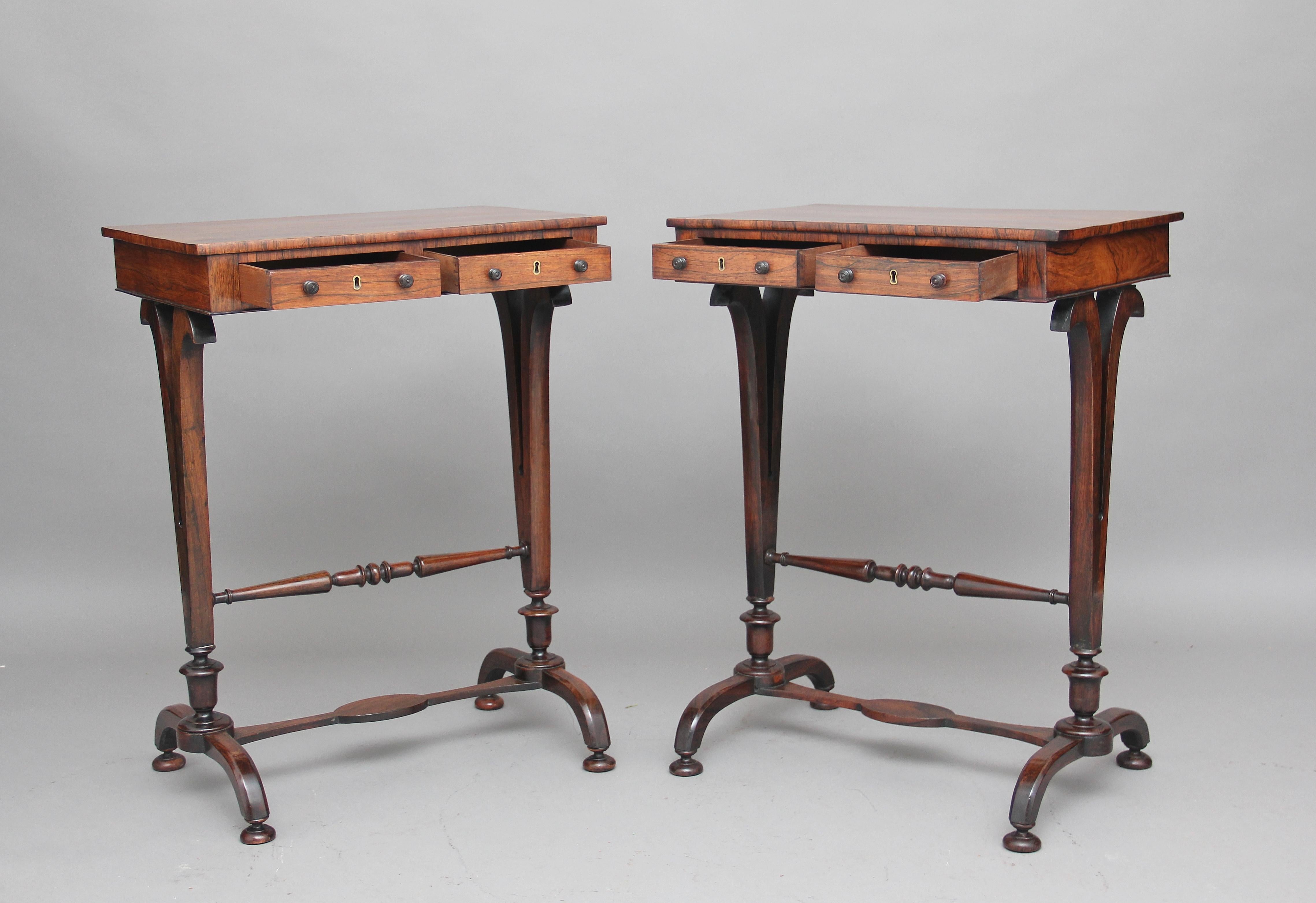 A fine pair of 19th century rosewood lamp / side tables, each with a pair of mahogany lined drawers with original turned wooden knobs and a pair of dummy drawers on the reverse, with nicely shaped end supports united by a turned stretcher, standing