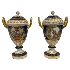 Pair of 19th. century Royal Vienna lidded urns.