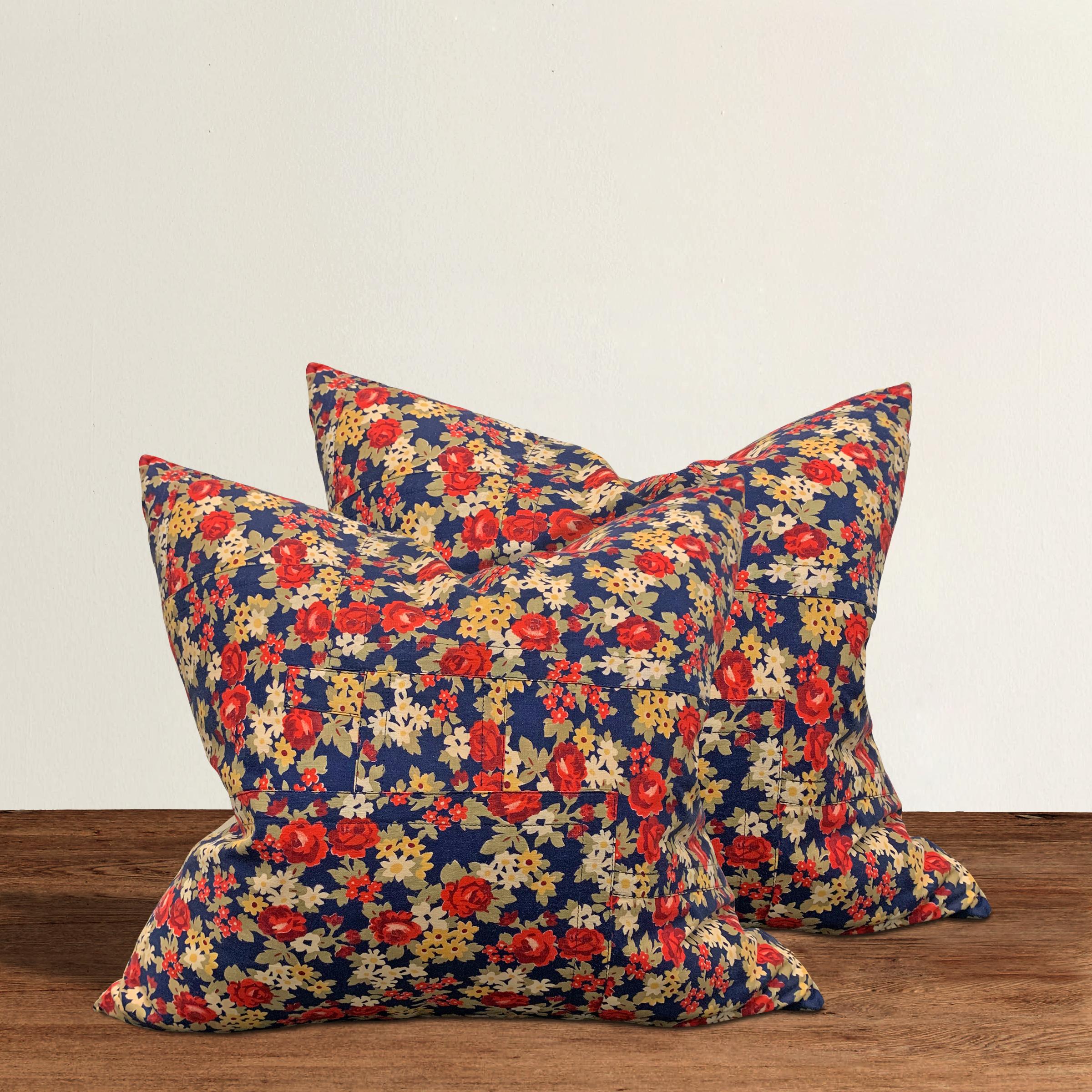 Pair of pillows made from 19th century Russian block printed cotton panels with multicolored flowers, backed with solid linen and filled with down.
