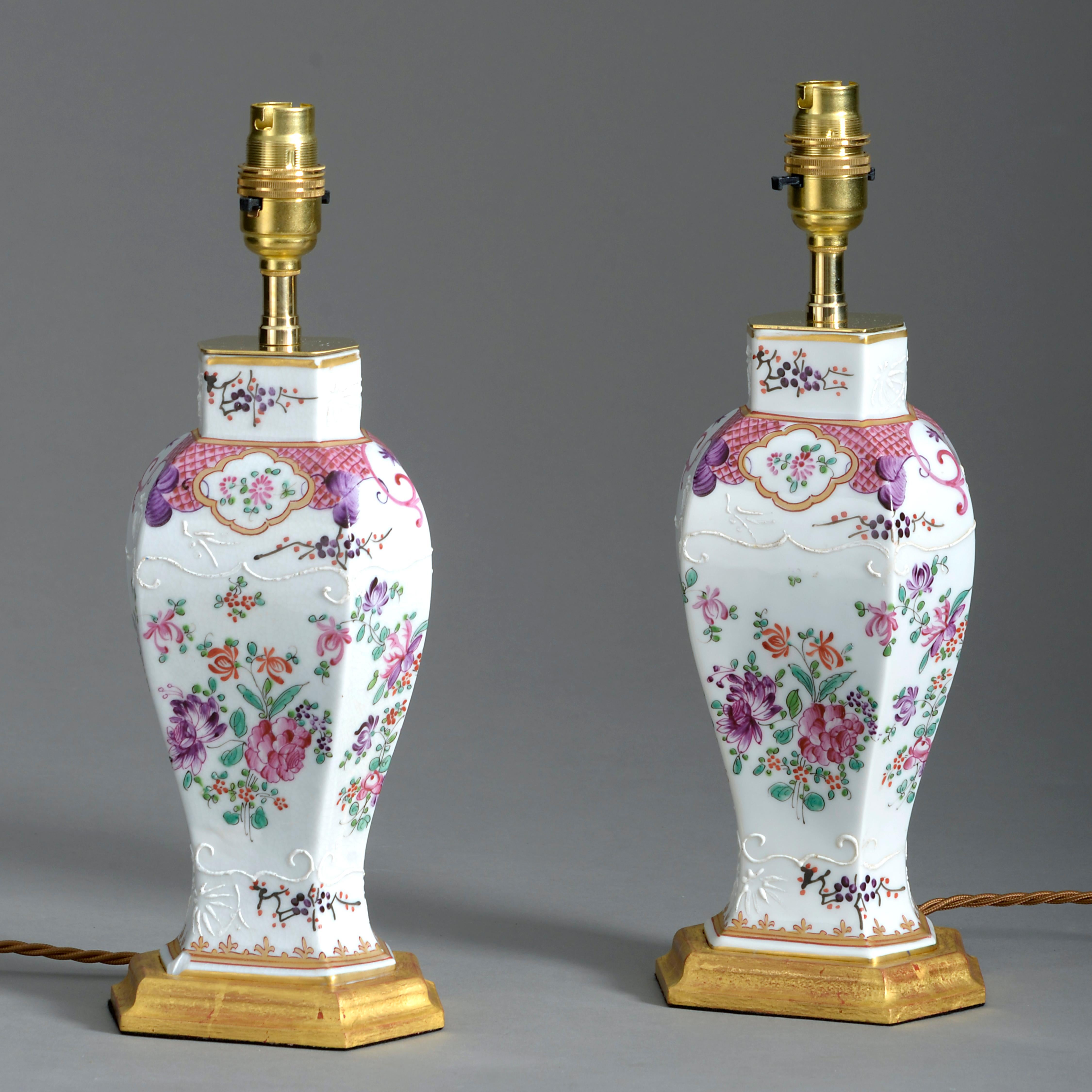A fine pair of late 19th century famille rose porcelain vases by Samson in the Qianlong taste, of hexagonal baluster form and decorated throughout with floral vignettes. Now mounted upon water gilded bases and wired as table lamps.

Dimensions