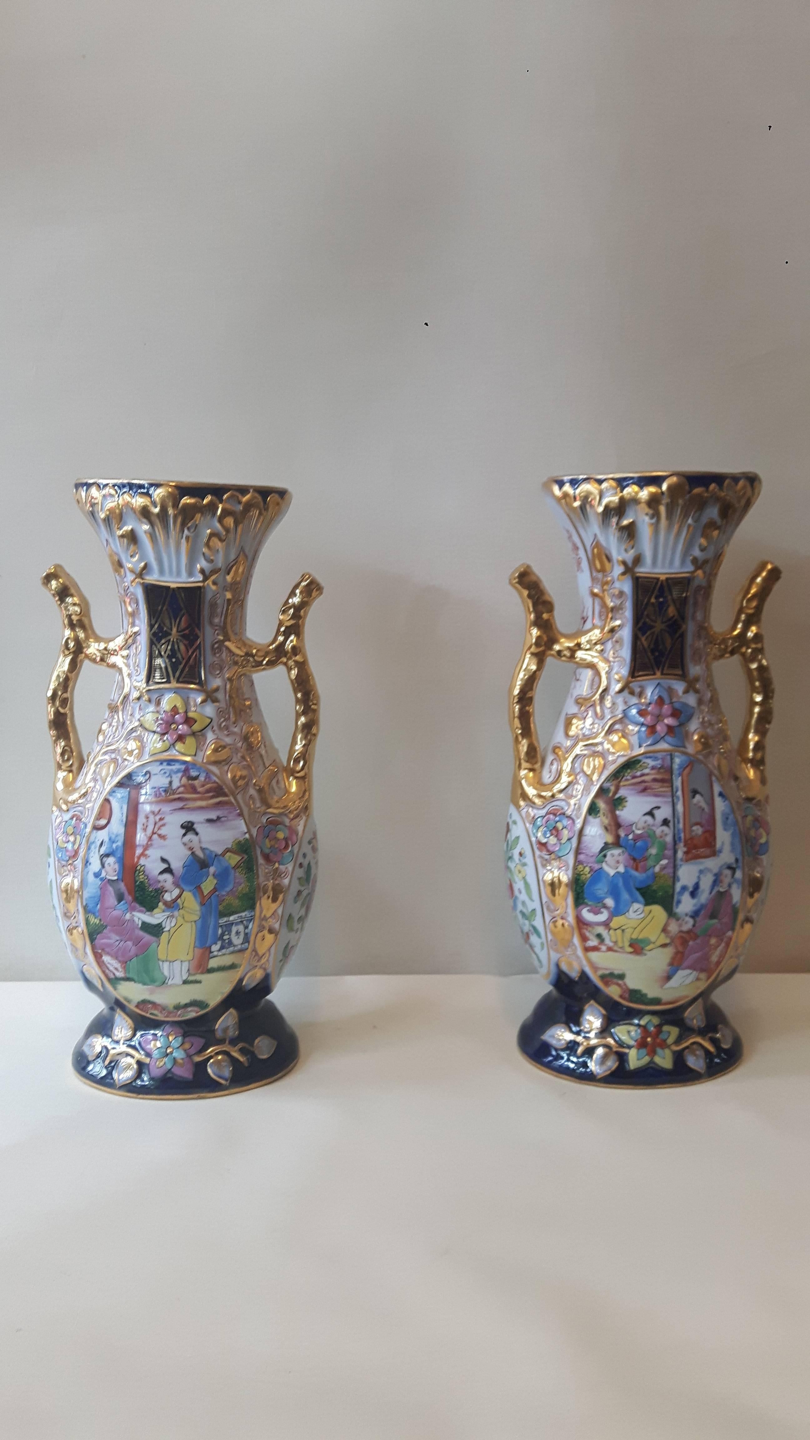 A very ornate pair of Samson Paris porcelain vases, entirely hand-painted in Cantonese chinoiserie fashion, heavily gilded, circa 1880.