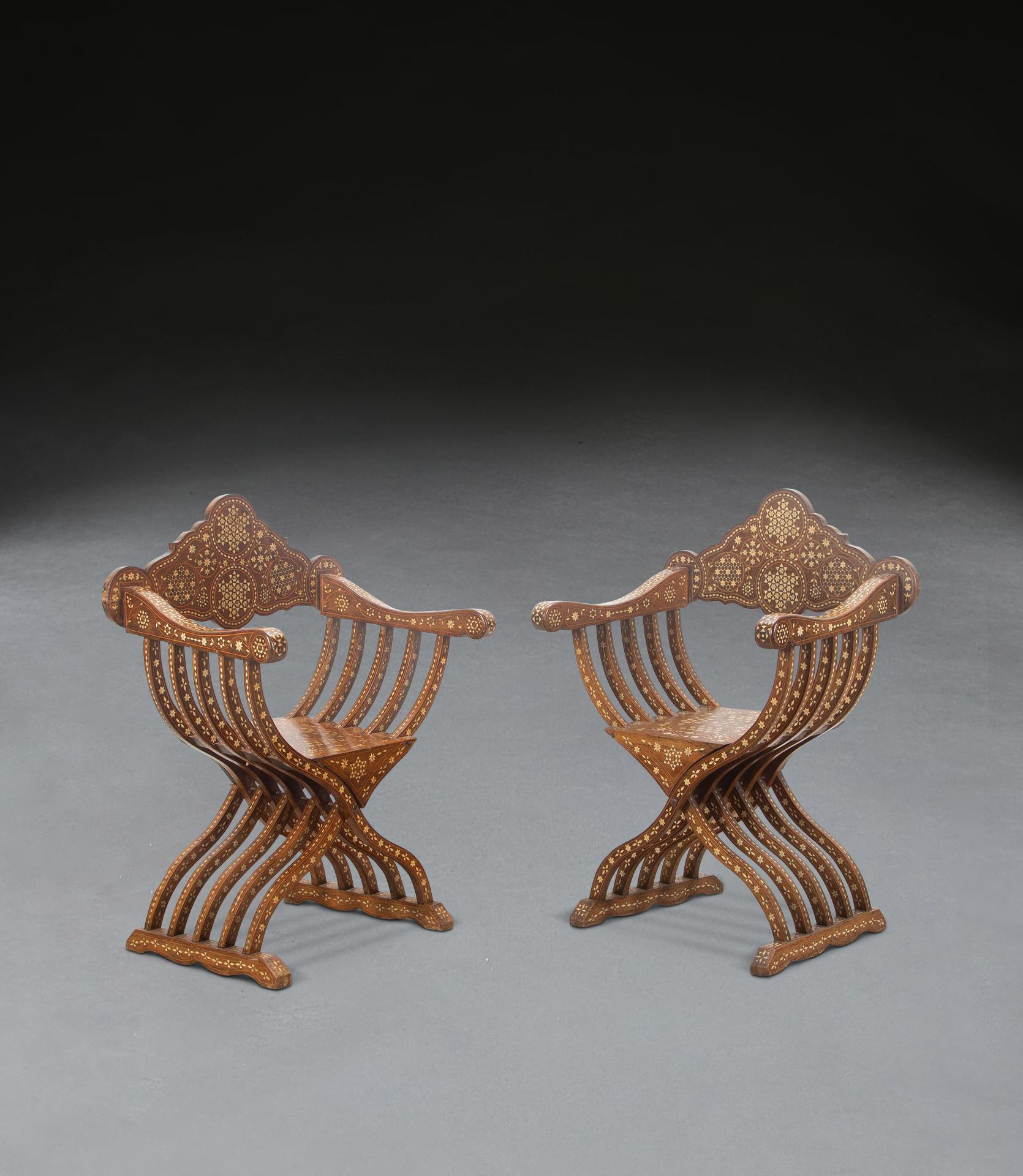 A stylish pair of late 19th Century Savonarola chairs, constructed in walnut and intricately designed with bone inlay throughout, the shaped back rests leading to swept arm rests and X-frame supports below with central seat, all terminating in