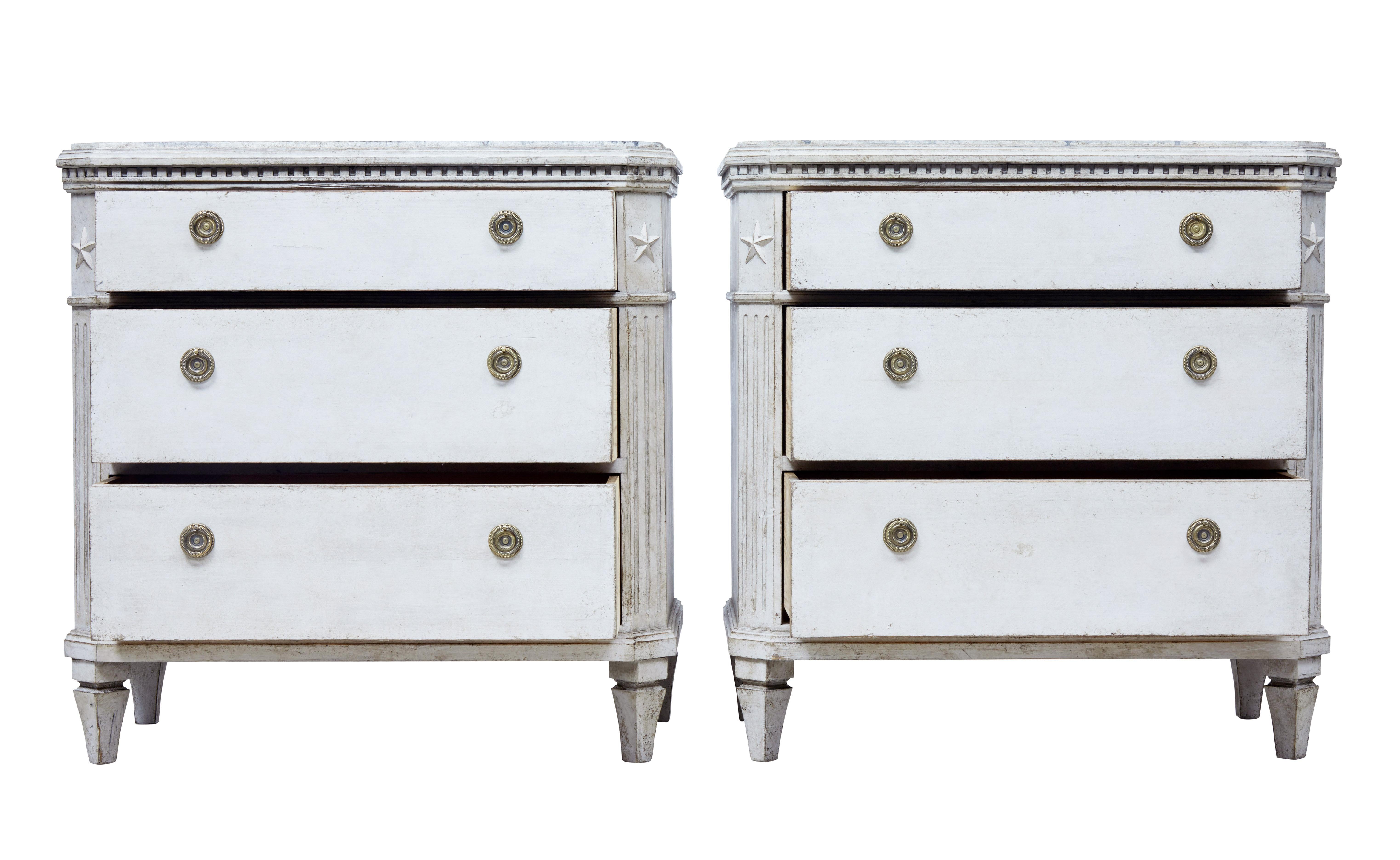 Pair of painted Swedish commodes, circa 1870.

Top surface has been decorated with a hand painted faux marble effect. Dentil frieze below the top surface which leads down to the 3 drawers with working locks and key. Canted corners with applied