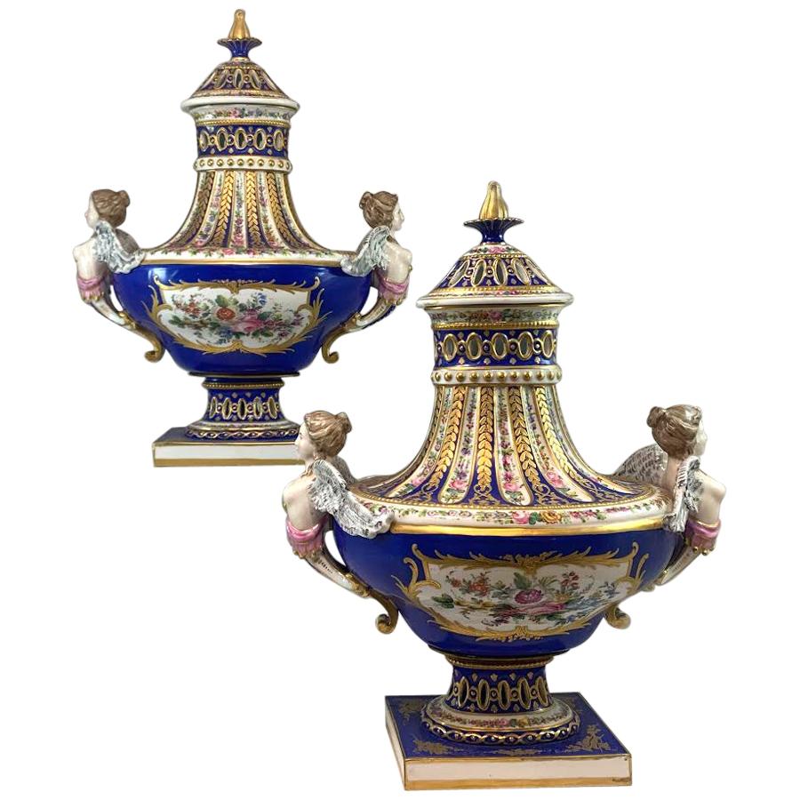 Pair of 19th Century Sèvres Hand Painted Reticulated Covered Urns
