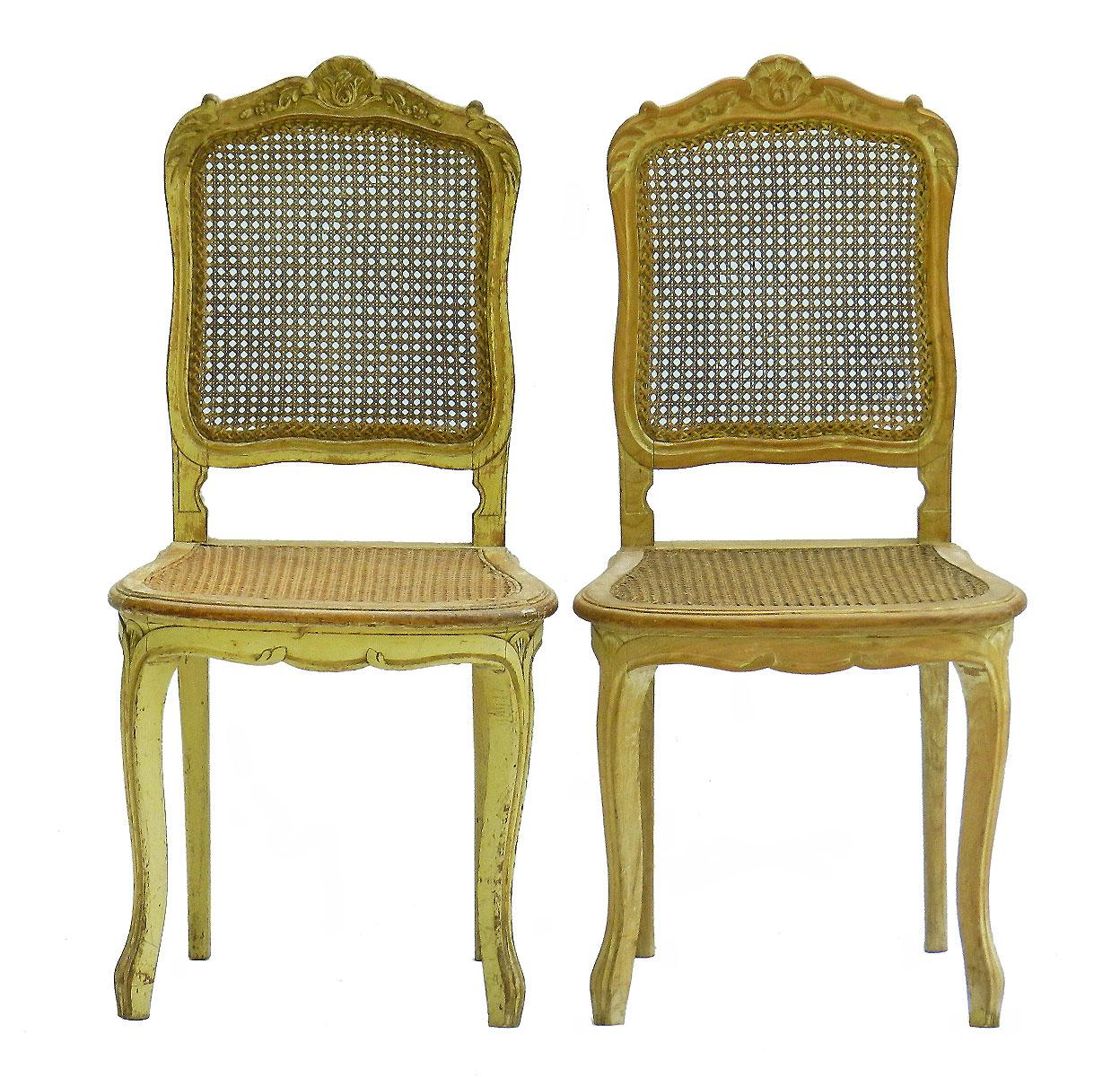 Pair of 19th century side chairs French Louis XV revival original paint caned
Original paint gloriously distressed through age with lovely patina
Original cane work is good
Sound and solid
Really charming pair of accent chairs for an