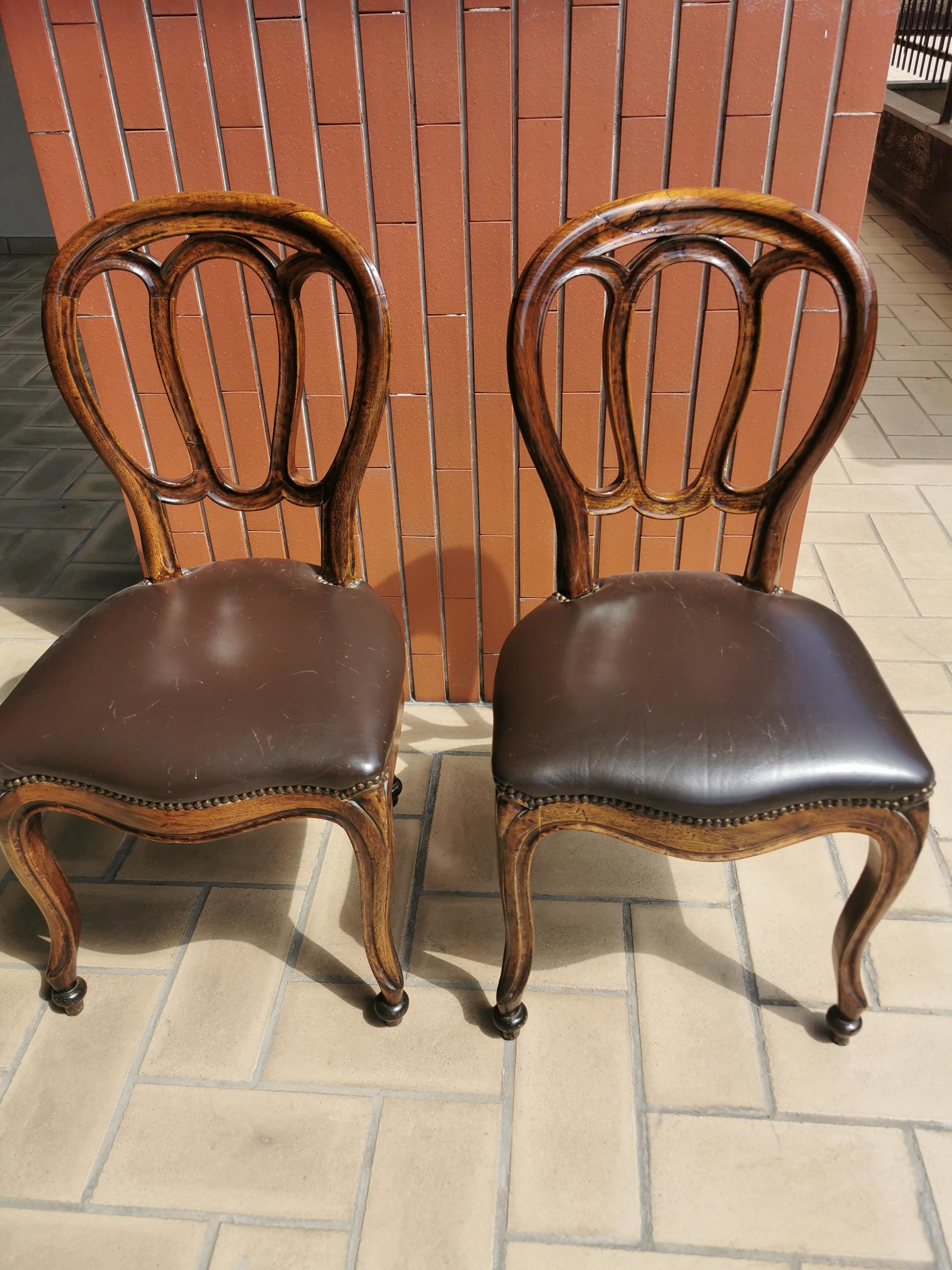 Pair of 19th century side chairs, walnut, leather, circa 1860 Italy
wood structure is in very good condition, 
leather part is also in good condition just needs some creams to clean. 
quality items, carved walnut and very elegant shape and