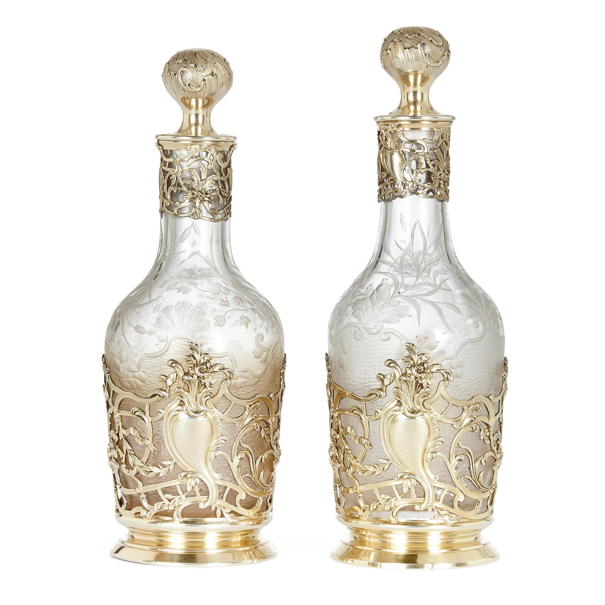 Pair of 19th century silver and crystal decanters
French, late 19th century
Measures: Height 22cm, diameter 8cm

This fine pair of decanters is by Tétard Frères silversmiths, and bears Minerva hallmarks. They are each hung with white floral
