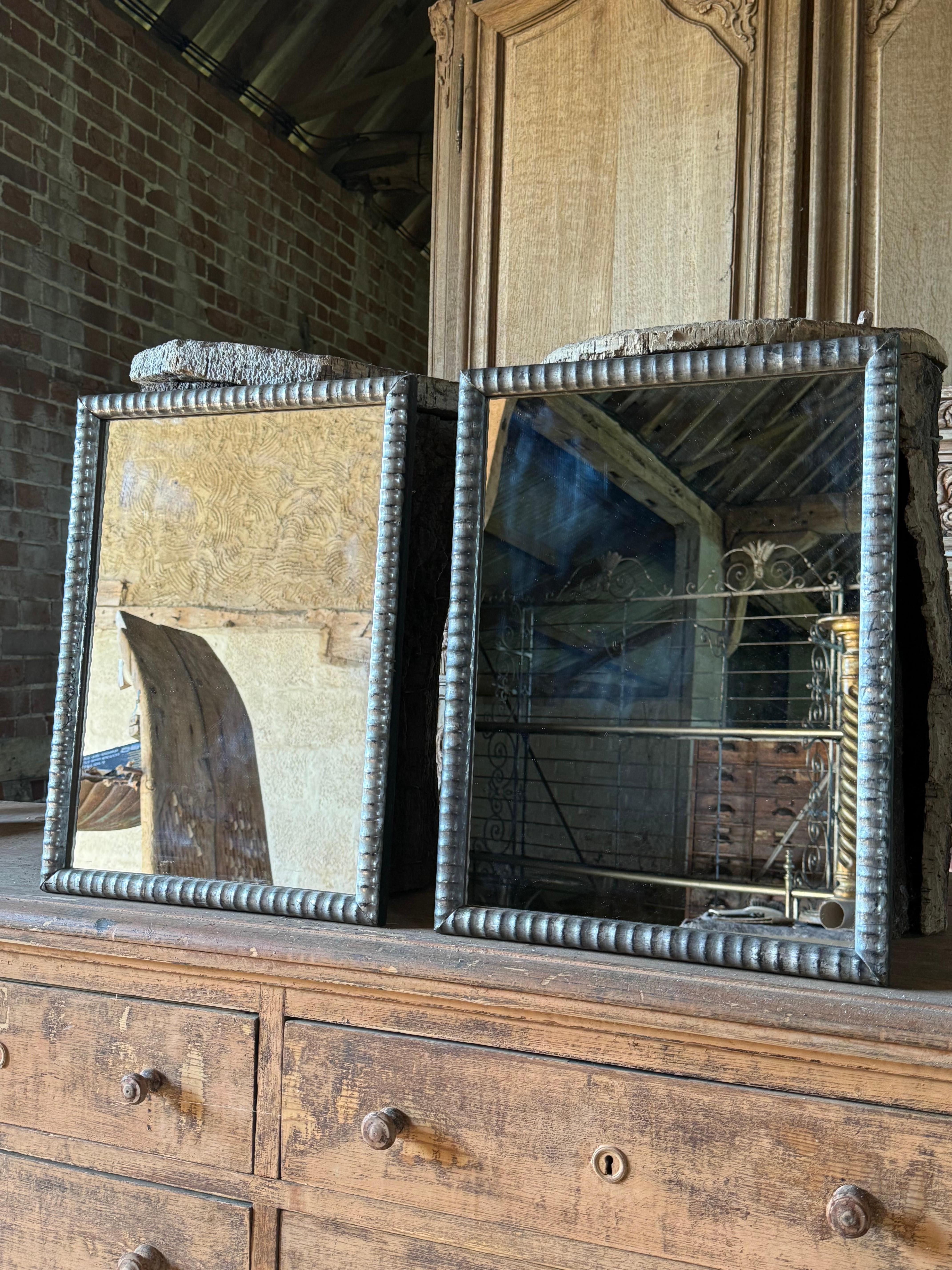 A pair of 19th century silver gilded wall
mirrors with carved wood frames. The original silver gilding has lovely wear adding to their look and appeal.
Possibly later glass and later backboards. In good condition ready to use.


Please contact us