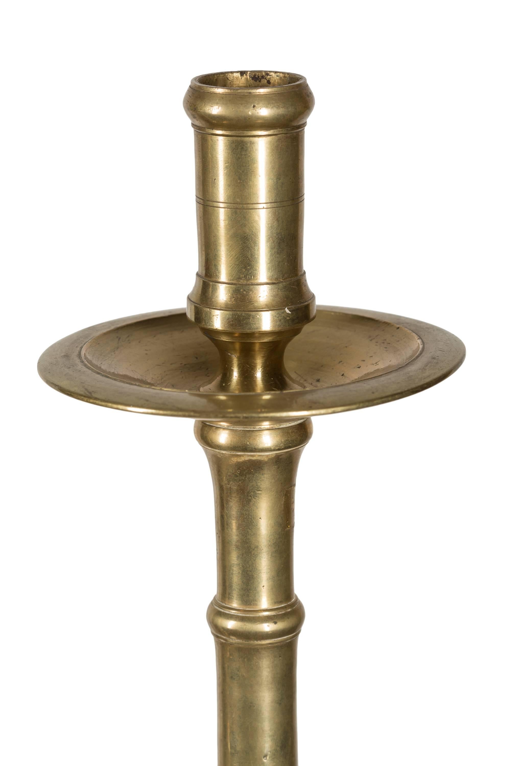 This classic pair of dramatic (over one-half meter tall) 19th century Spanish church altar candlesticks will make for a strong centerpiece or accent in a variety of interior styles. 
The use of candles has been part of the Catholic ritual since
