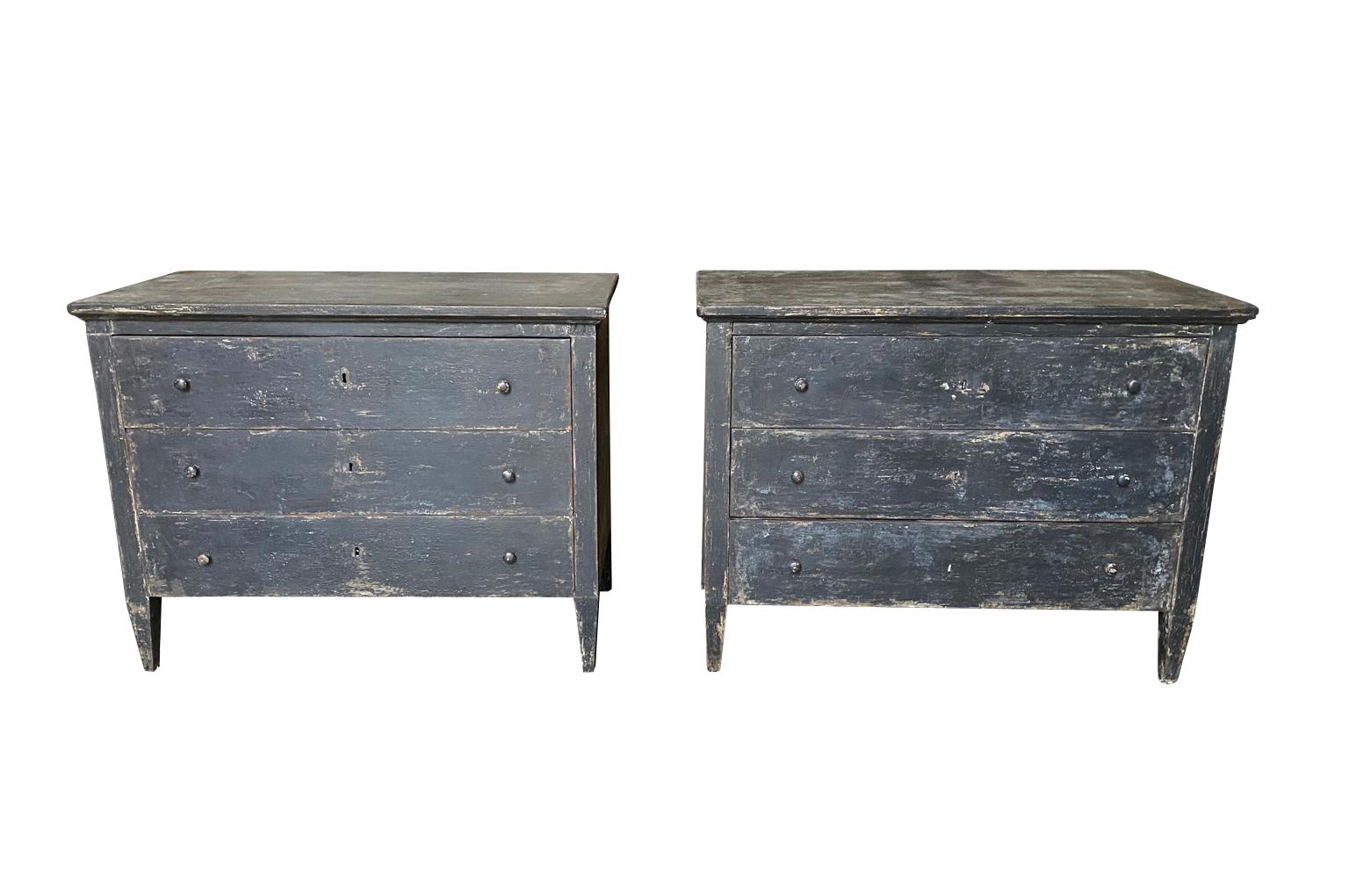 A sensational pair of late 19th century painted commodes from Spain. Great construction with three drawers over tapered legs. The painted finish is wonderful with a beautiful patina and texture. Great as bedside cabinets or converted into vanities.