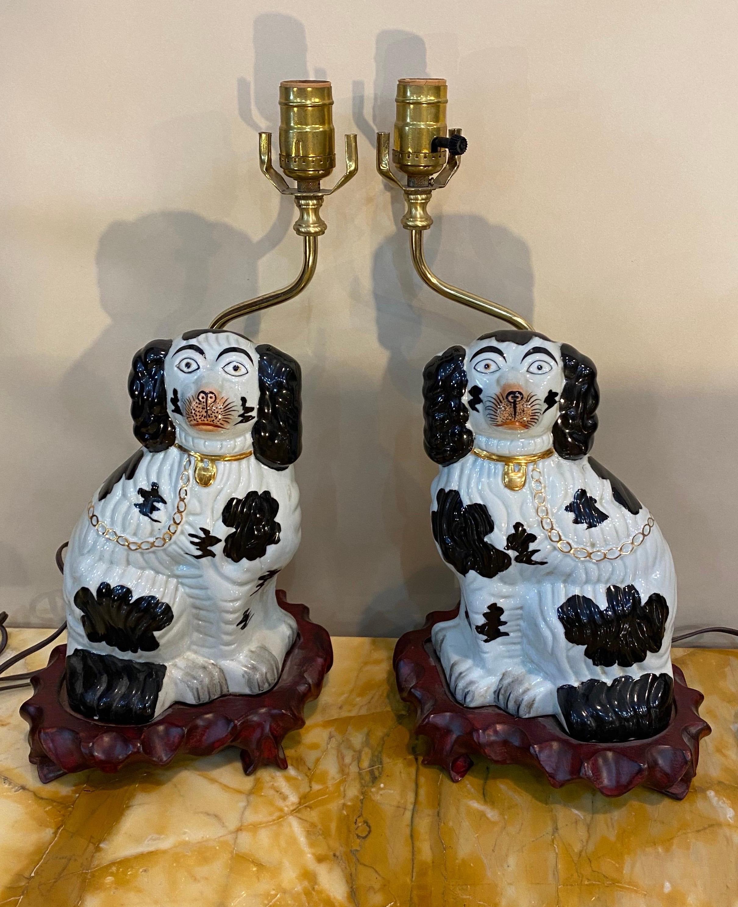 Pair of 19th century Staffordshire dogs mounted as lamps. Great pair of Cavaliers on wooden bases. 

Overall dimensions (top of socket)- 7