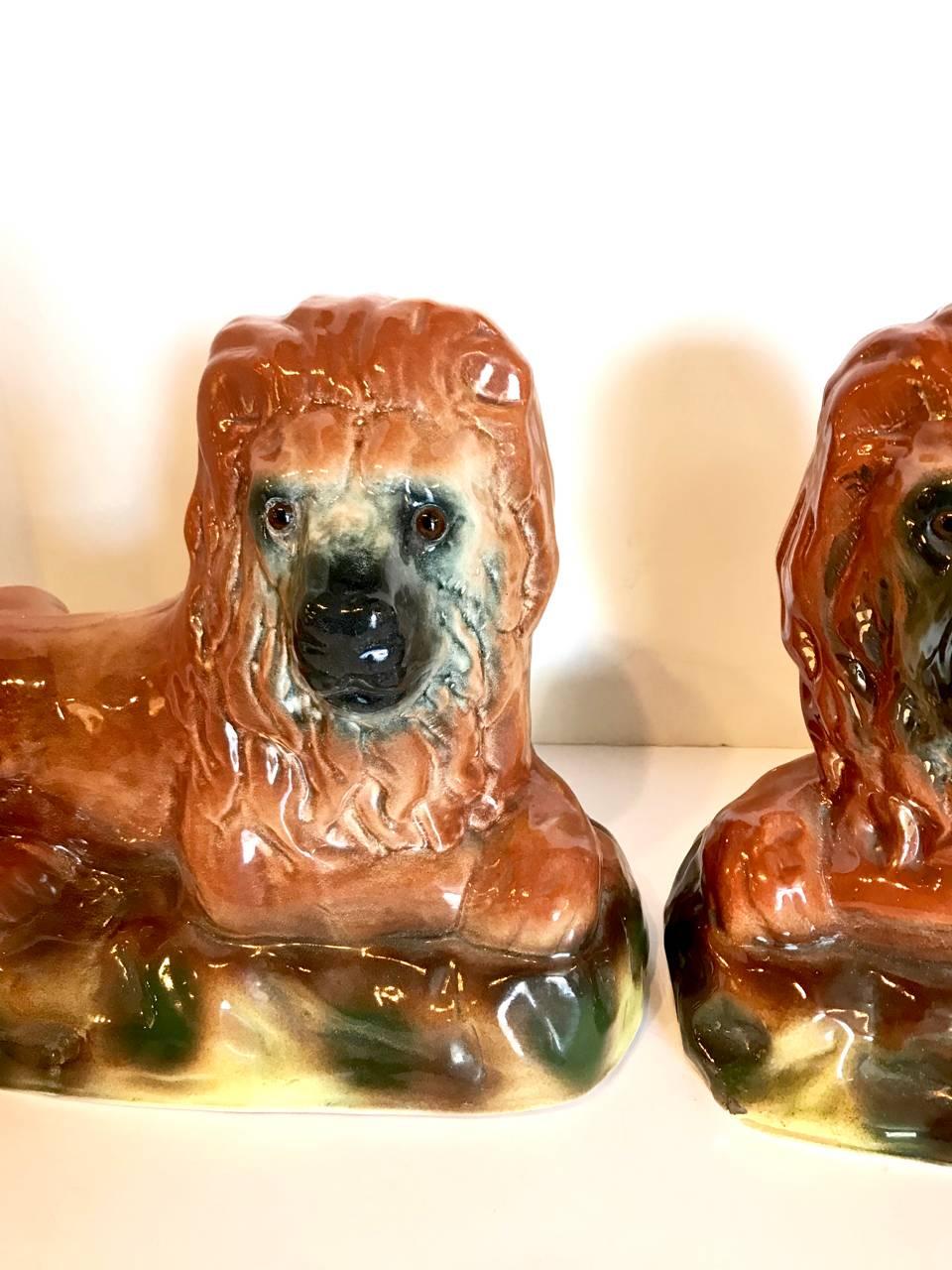High Victorian Pair of 19th Century Staffordshire Recumbent Lions For Sale