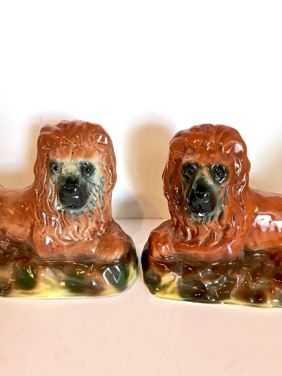 English Pair of 19th Century Staffordshire Recumbent Lions For Sale