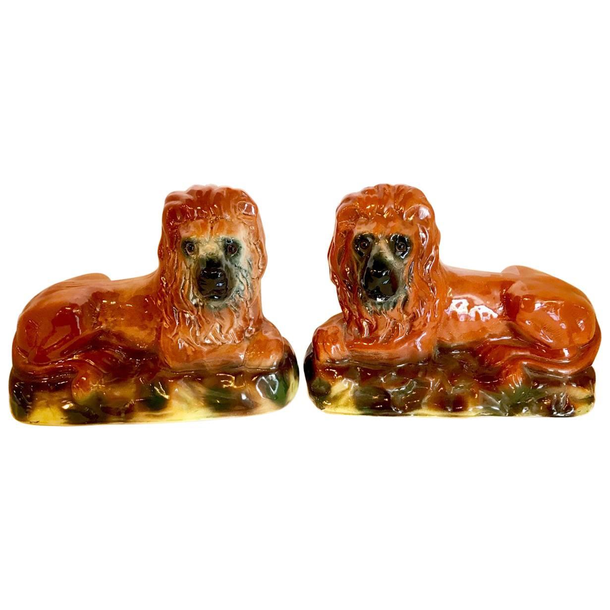 Pair of 19th Century Staffordshire Recumbent Lions For Sale
