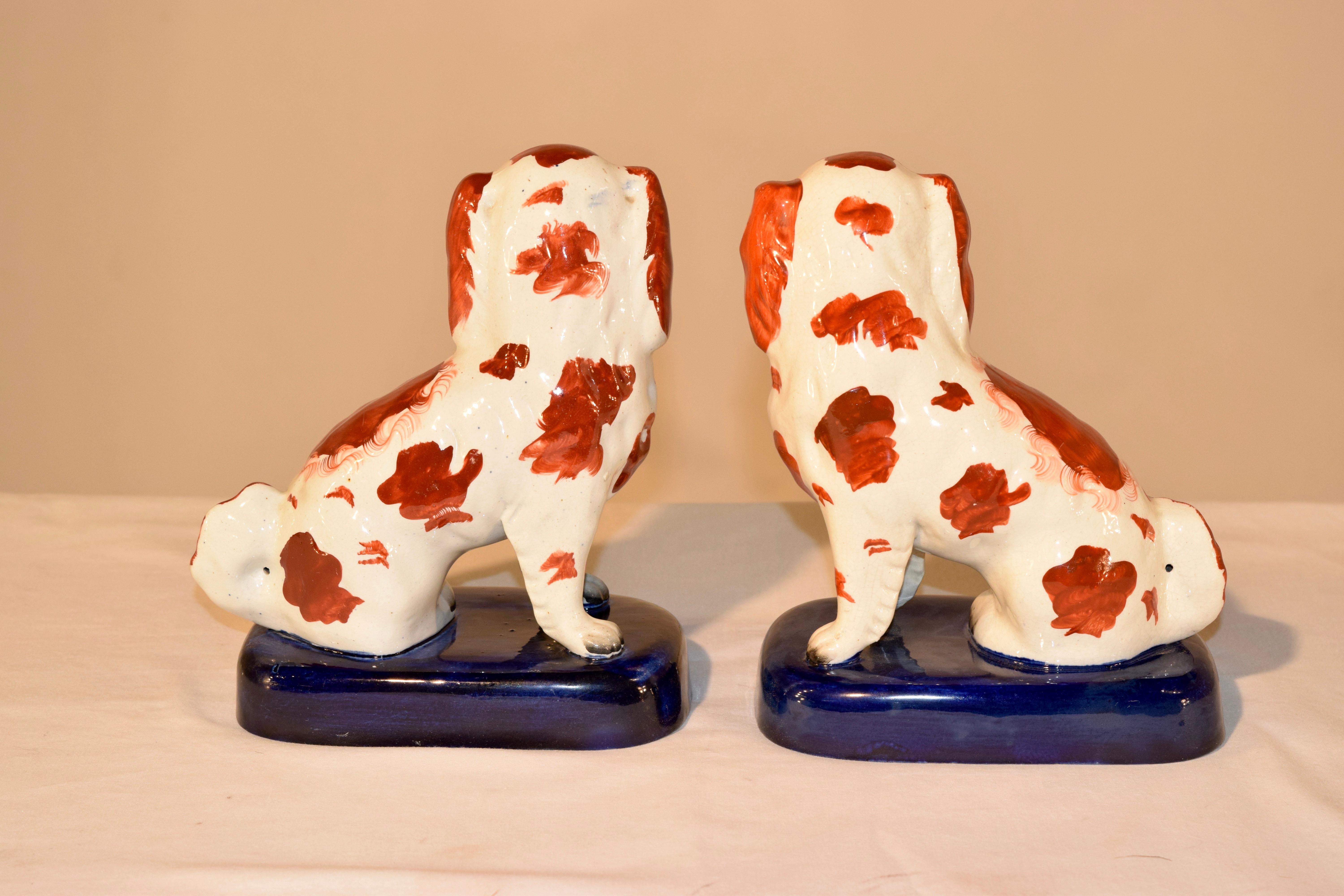 Glazed Pair of 19th Century Staffordshire Spaniels on Bases For Sale