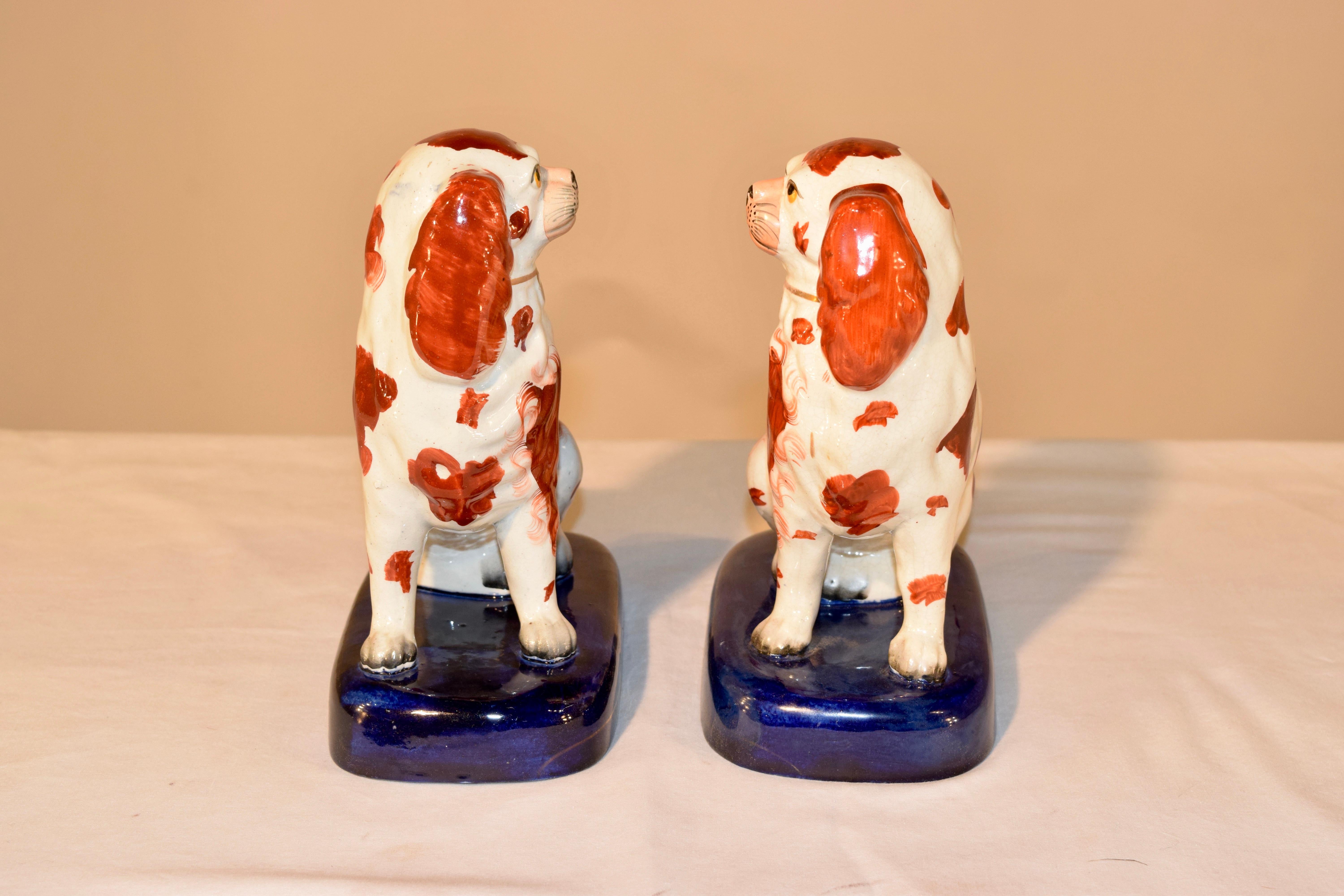 Porcelain Pair of 19th Century Staffordshire Spaniels on Bases For Sale