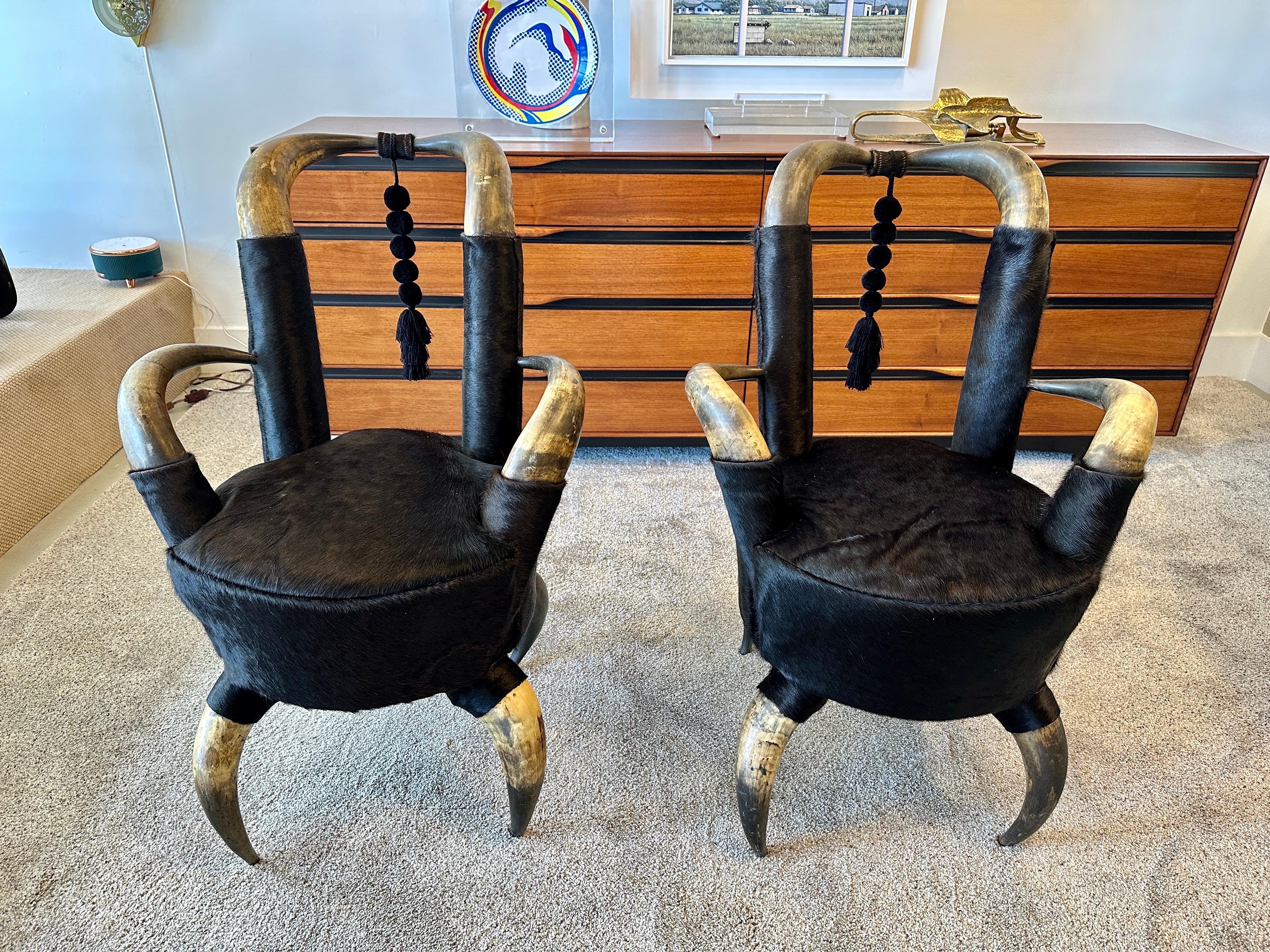 These are a beautiful matching pair of steer horn side chairs from the late 19th C., recently reupholstered with deep black cowhide leather. They are in the smaller scale for sitting (interior width is 13 inches and depth is 17 inches). SEE ALL